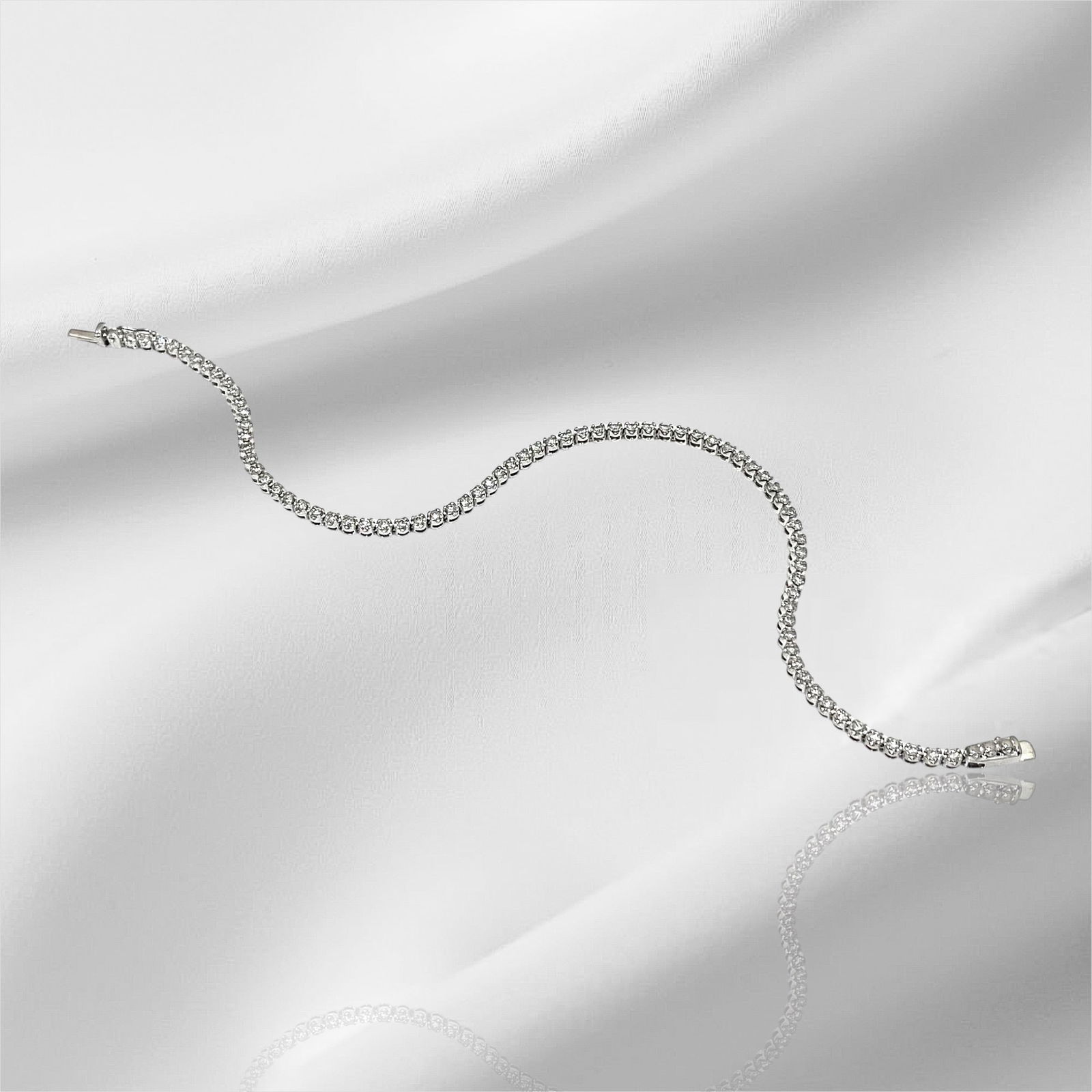 Over 2TCW Elegant Diamond Tennis Bracelet in 14k White Gold: Condition: Good. Brand: Unbranded Material: 14k White Gold. Jewel: Diamond. (3mm) Diamond Count: 74 Round Brilliant-Cut Diamond. Total carat weight: Over 2TCW Clarity and Color: VS2-SI1; I-J. Bracelet