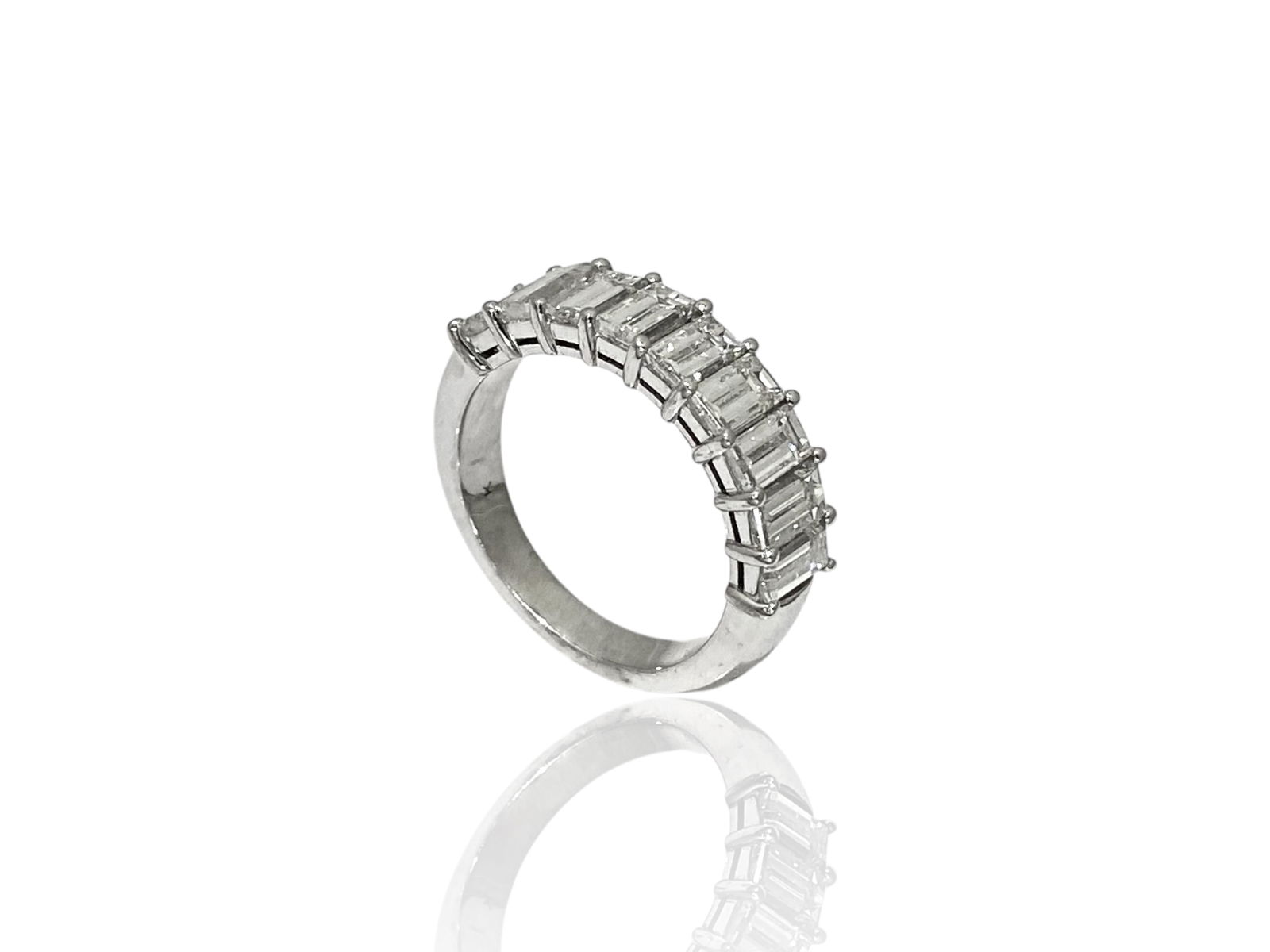 Apx 2.5 TCW Emerald-cut Diamond Anniversary Band in 18k White Gold: Condition: Like New Brand: Unbranded. Metal: 18k White Gold. GemStone: Emerald-cut Diamond. Diamond Count: 9 Stones. Carat Weight: Apx 2.5 TCW Color & Clarity: VS1; H-I. Ring Size: 7. Weight: 6.6 gram