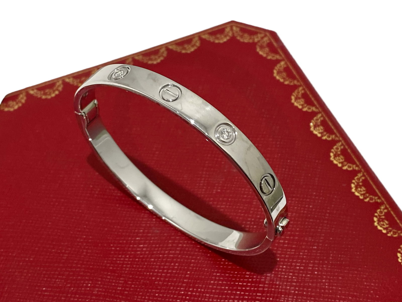 Cartier Love Bracelet 4 Diamond 18K White Gold Size 17: Condition: Like New Brand: Cartier Material: 18K White Gold Gemstone: Diamond Diamonds: Set with 4 brilliant-cut diamonds totaling 0.42 carats. Size: 17 Retail Price: $13,700 Comes in Original Box or