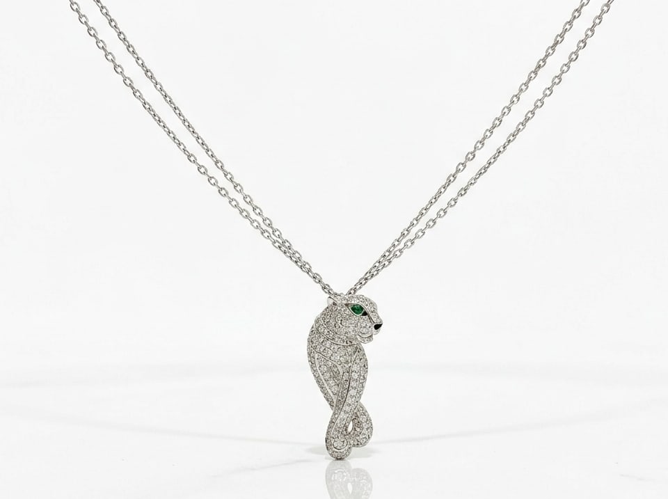 Cartier Panthere de Cartier 18K Gold Pave Diamonds, Emerald, Onyx, Double Chain: This Panthere de Cartier 18K White gold necklace carries the iconic Panther symbol which has been a sign of recognition of the timeless brand for decades, making the creation all the more special. Cra
