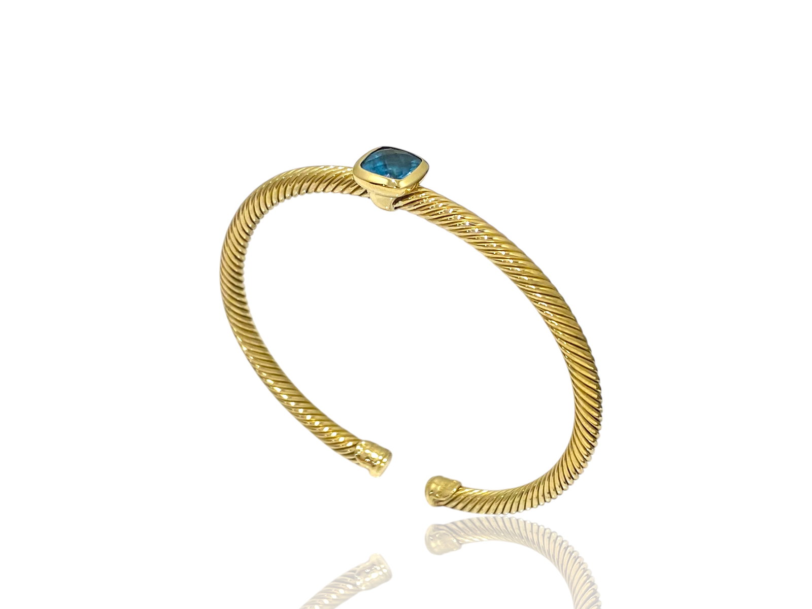 David Yurman 18K Yellow Gold Blue Topaz 4mm Classic Cable Cuff Bracelet: Condition: Like New. Brand: David Yurman. Material: 18K Yellow Gold. GemStone: Blue Topaz, 9mm. Bracelet Width: 4 mm. Weight: 22.2 grams.