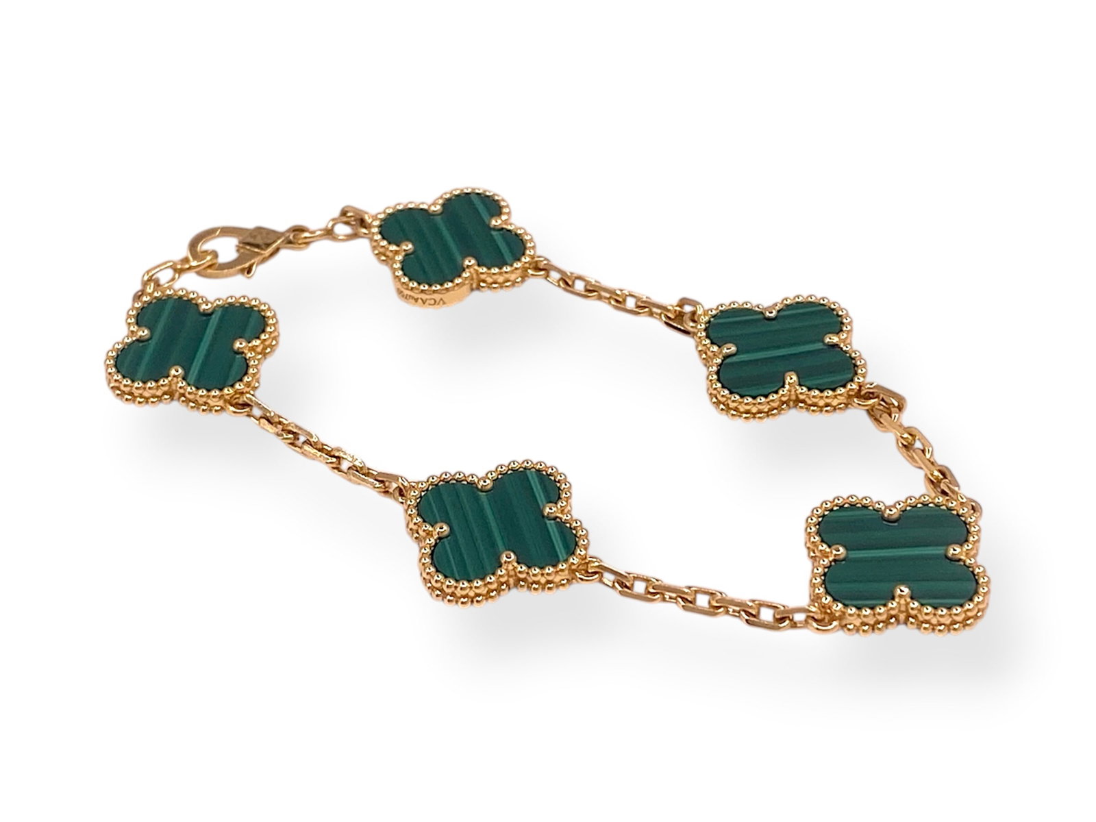 Van Cleef & Arpels Vintage Alhambra Malachite 5 Motif Bracelet in 18 Yellow Gold: Brand/Maker: Van Cleef & Arpels Item: Bracelet. Style: 5 Motif. Serial: JF202141 Metal: 18K Yellow Gold Total weight: 12.3 grams Motif Width: 15 MM Size: 6.5" inches Hallmark: VCA Au 750, JF202141, VC
