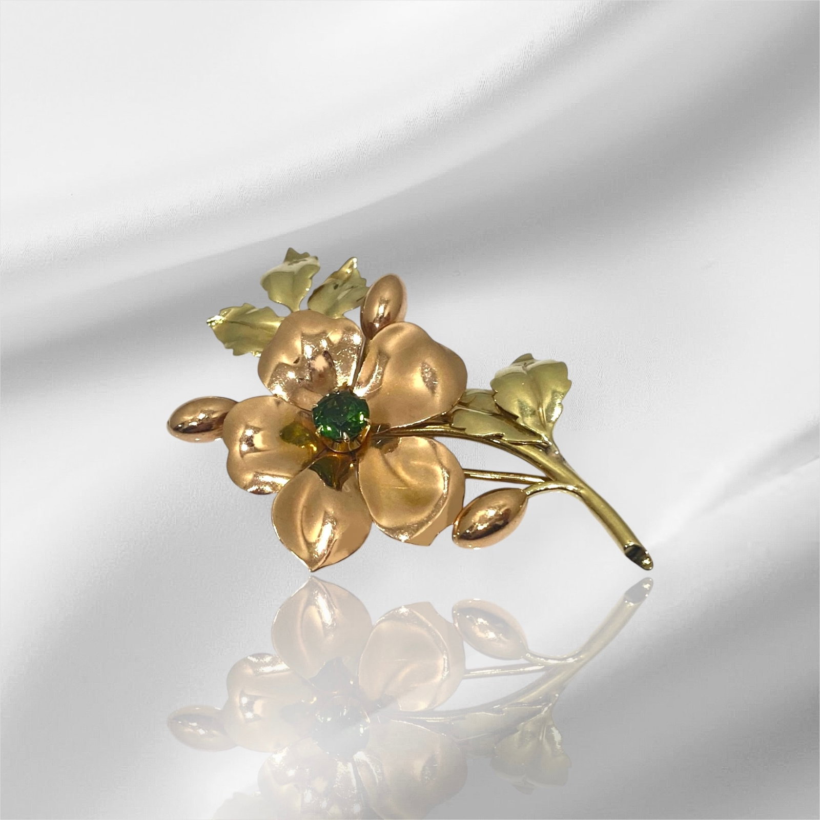 Signed Tiffany & Co. 14k Two Tone Gold Double Leaf Brooch with Green Tourmaline: Condition: Excellent Brand: Tiffany & Co. Type: Brooch Metal Purity: 14k Two Tone Gold GemStone: Green Tourmaline Brooch Dimensions: Length: 2.5"inch Width: 1.8" inch Stamp: "Tiffany & Co." Weight: 12