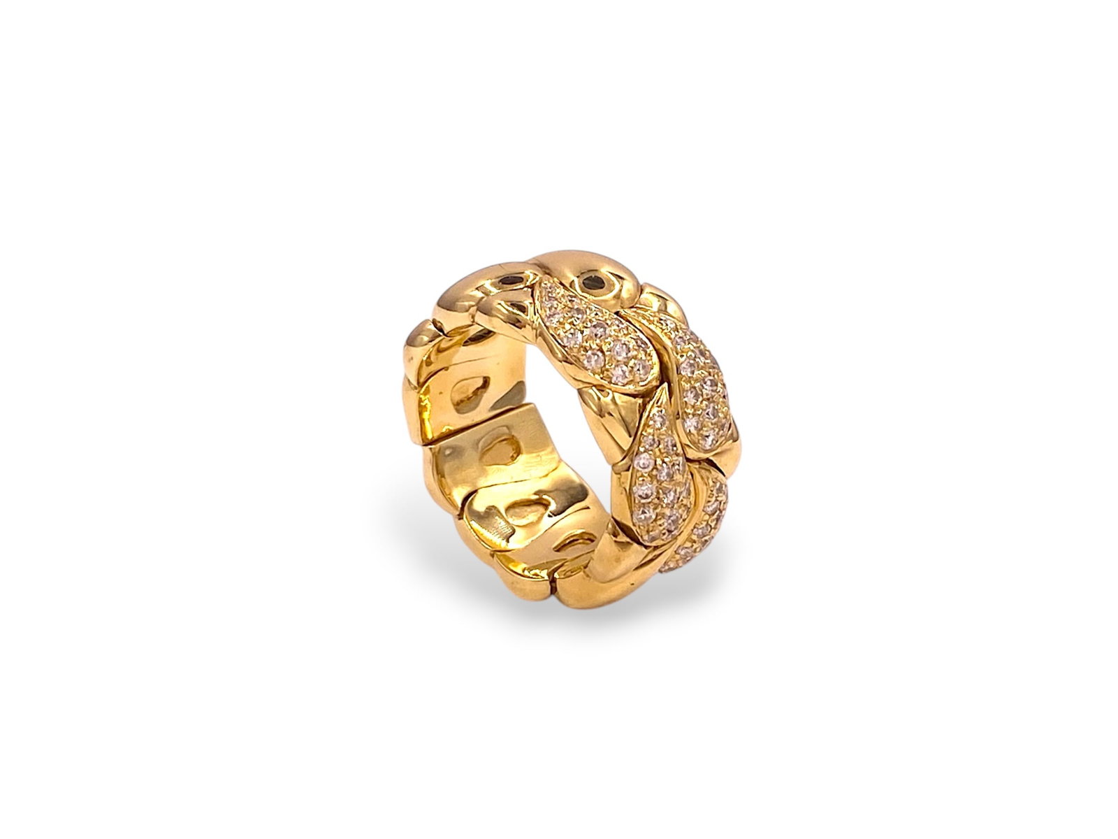 Chopard Casmir Diamond Flexible Ring in 18k Yellow Gold: Item: Ring. Brand: Chopard. Metal: 18K Yellow Gold Total weight: 19 grams Ring width: 11mm Ring Size: 7-8 Flexible Diamonds: 56 Natural Round Brilliant cut stones. Total Carat Weight: 1 Carats. Clarit