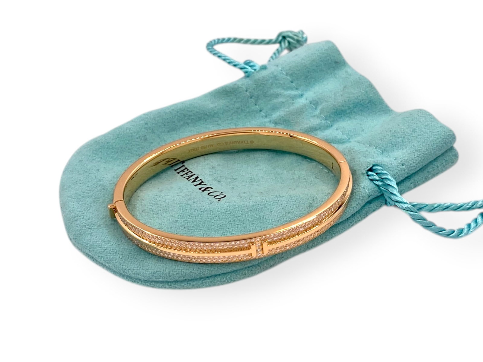 Tiffany T Pavé Diamond Hinged Bangle in 18k Rose Gold Medium Size: Brand/Maker: Tiffany & Co. Item: Bracelet Style: T Pave. Metal: 18K Rose Gold Stone: Round-cut Diamond. Diamond Carat Weight: 0.82 carats, VVS E-F. Total weight: 35.8 grams Size: Fits wrists up to 6.2