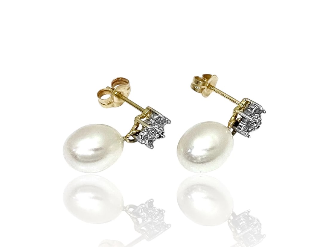Cultured Pearl and Diamonds Pair of Stud Earrings in 14k Gold: Item: Pair of Stud earrings (for pierced ears) Stones: Cultured Pearls and Diamonds Pearls: 9mm x 7mm Diamonds: Natural, 14 round cut brilliant stones Earring measures: 17mm top to bottom Metal: 14K y