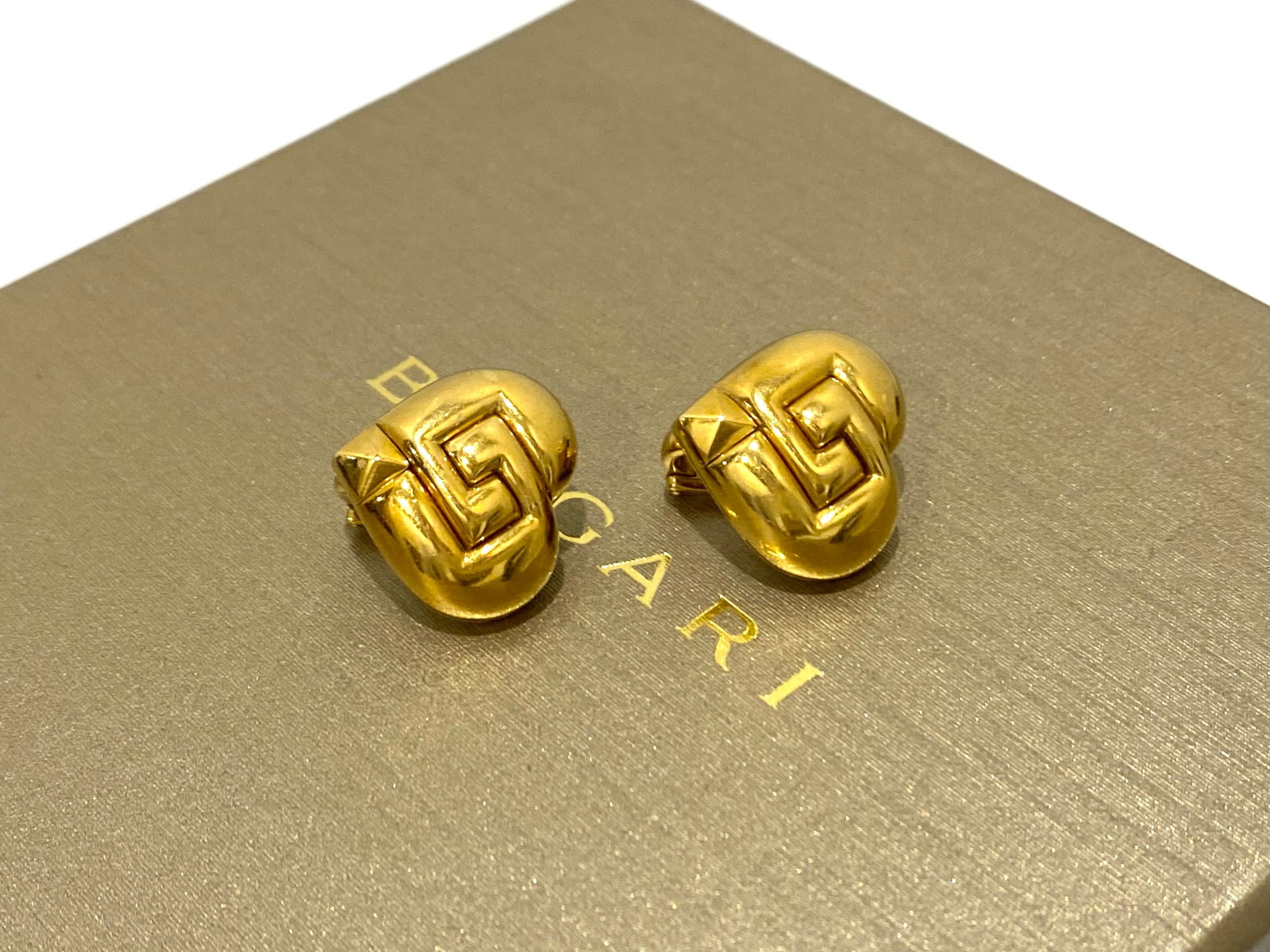BULGARI 18k Yellow Gold Dome Heart Earrings with Omega Clip-ons: Condition: Like New Brand: BULGARI Material: 18k Yellow Gold Dimensions: 1.8" Length and Width Stamp: BULGARI Weight: 16.4 grams