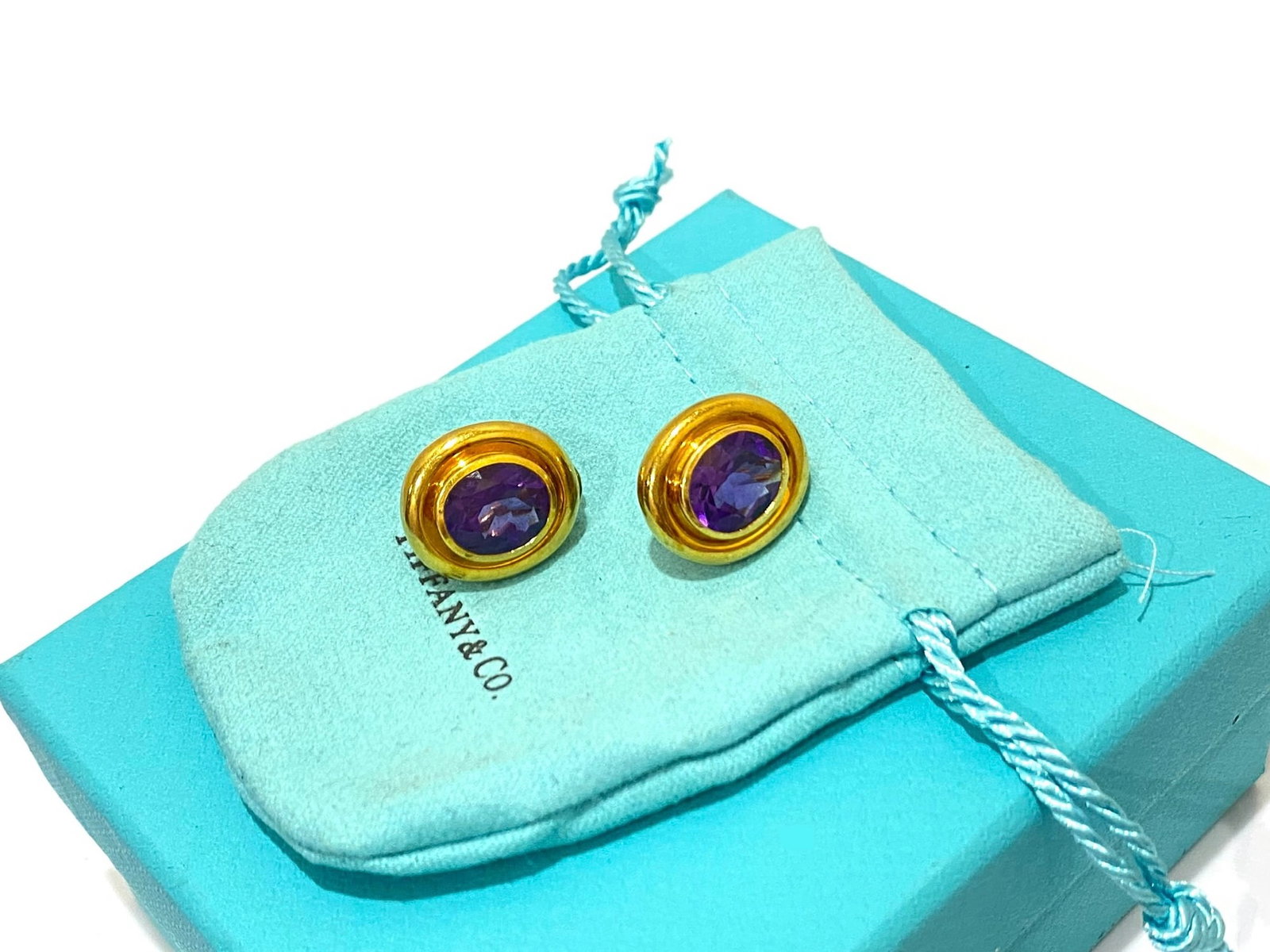 Tiffany & Co. 1987 Paloma Picasso Clips Earrings 18k Yellow Gold with Amethysts: Creator: Paloma Picasso for Tiffany & Co. Condition: Good Metal: 18k Gold,Yellow Gold Stone: Amethyst Stone Cut: Oval Cut Stamp: " Paloma Picasso" " Tiffany" " 1987" "18k" Weight: 14 Grams Comes with 