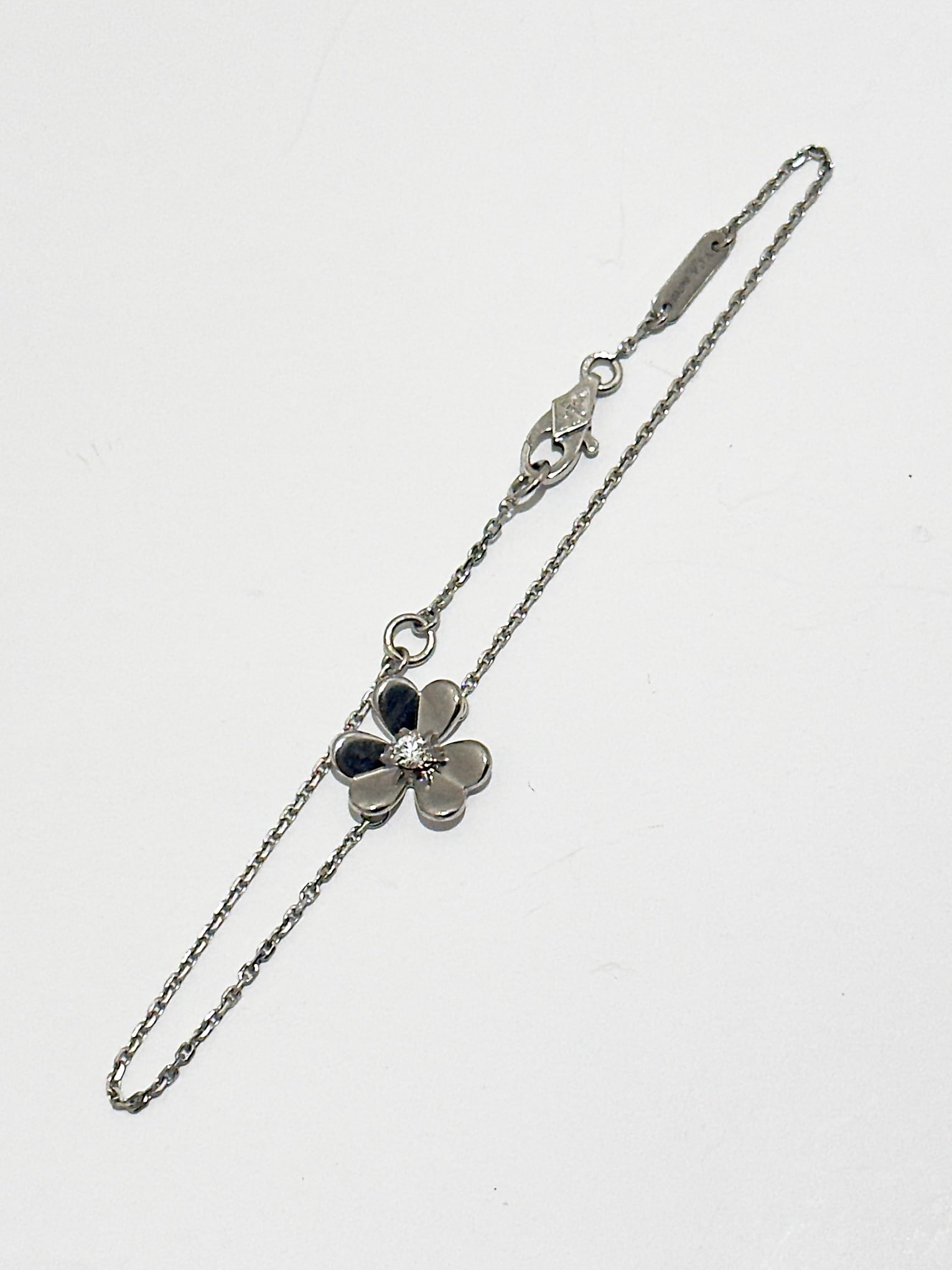 Van cleef and Arpels Frivole bracelet, mini model, 18K White gold, Diamond.: Condition: Like New. Brand: Van Cleef & Arpels. Material: 18K White Gold. GemStone: Diamond. Diamond: 1 stone, 0.05 carat. Clasp: Hallmark clasp in 18K white gold. Comes with THE REAL REAL Valuation R
