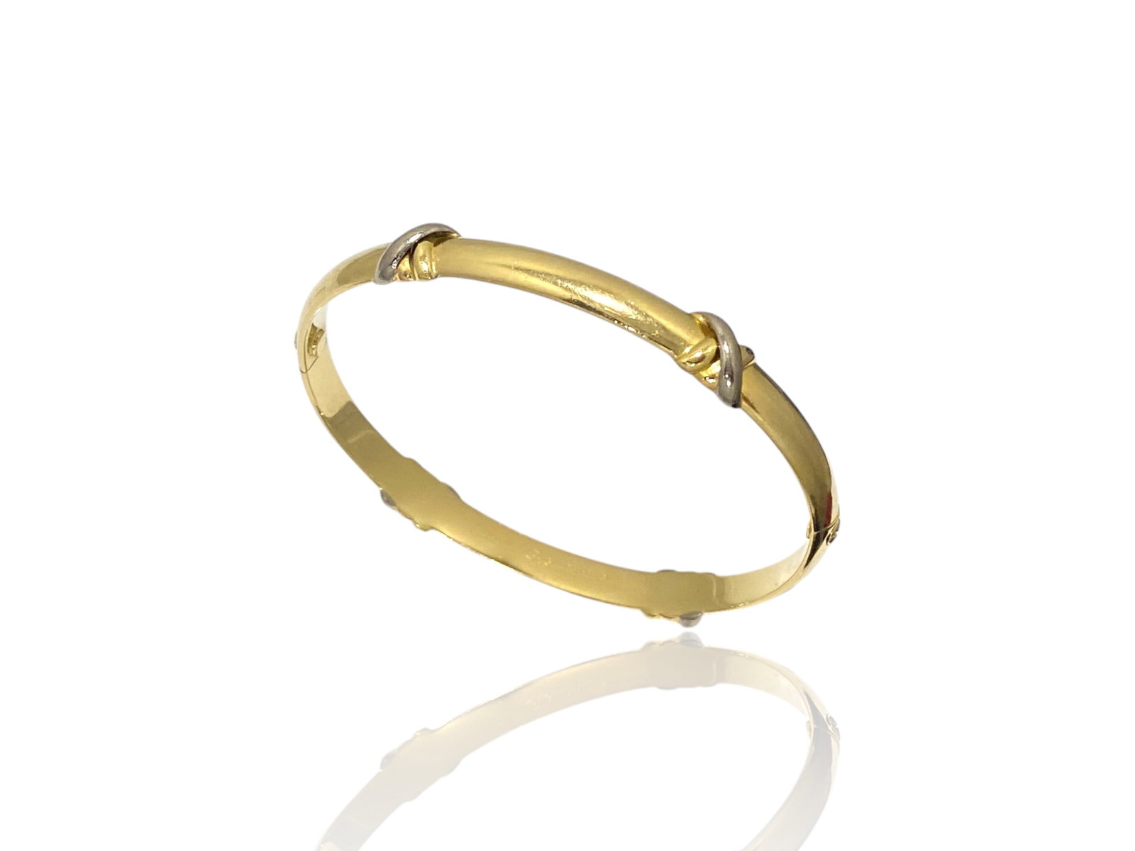 Vintage Cartier Trinity Bangle Bracelet Crafted in 18 Karat Gold: Condition: Like New. Brand: Cartier. Metal: 18k Yellow, Rose and White Gold. Bracelet Dimensions: Width: 7.5mm. Weight: 27.5 grams