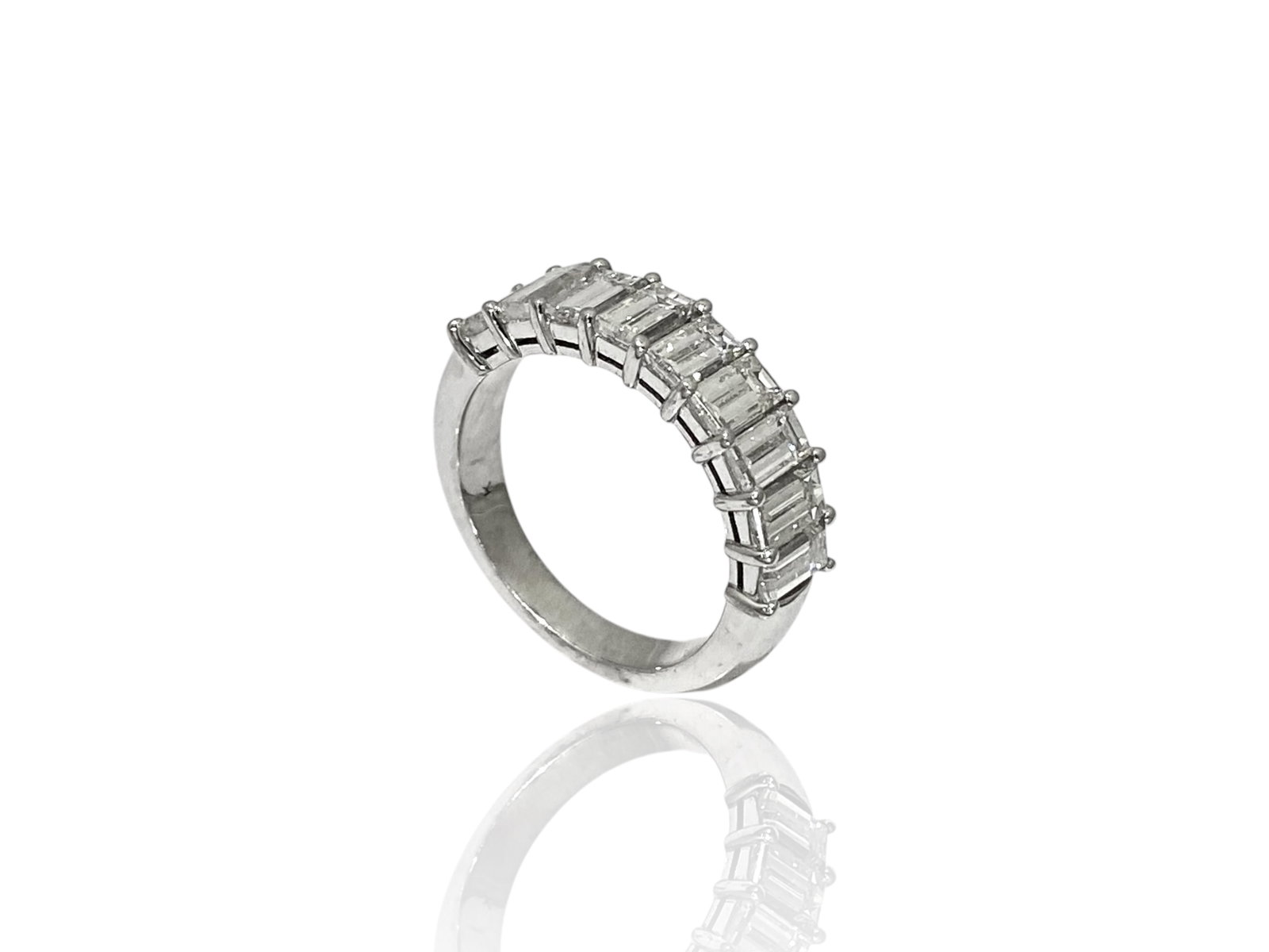 Apx 2.5 TCW Emerald-cut Diamond Anniversary Band in 18k White Gold: Condition: Like New Brand: Unbranded. Metal: 18k White Gold. GemStone: Emerald-cut Diamond. Diamond Count: 9 Stones. Carat Weight: Apx 2.5 TCW Color & Clarity: VS1; H-I. Ring Size: 7. Weight: 6.6 gram