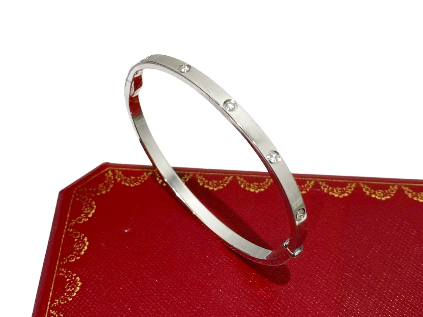 Cartier Love Bracelet 10 Diamond, 18K White Gold, Small Model Size 16: Condition: Like New Brand: Cartier Material: 18K White Gold. Gem Stone: Diamond Diamond: Set with 10 brilliant-cut diamonds totaling 0.21 carats. Size: 16 Comes in Original Box or Pouch Retail price: 