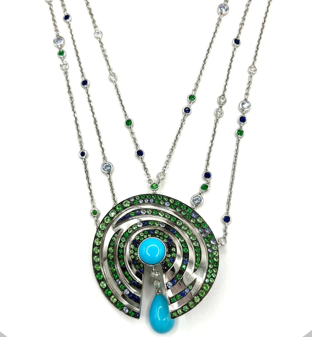 BOUCHERON Multi-Gemstone 3 Strand Adjust. Necklace in 18k White Gold w/Orig. Box: Item: Pendant Necklace. Brand: Boucheron Paris. Metal: 18K White Gold Total weight: 63.3 grams Pendant width: 51 mm Necklace Length: 32" inches Gemstones: Turquoise, Blue Sapphires, Tsavorite Garnets 