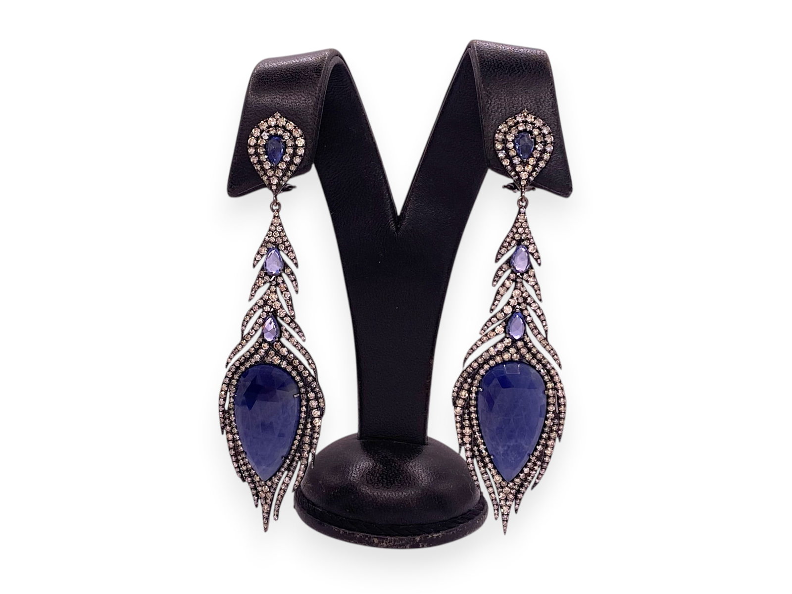 Tear Drop Blue Sapphires and Diamond Earrings in 18k Black Gold " Parade Design": Item: Drop Earrings. Brand: Unbranded. Metal: 18K Black Gold. Total weight: 25.3 grams. Gemstone: Blue Sapphires and Diamond. Blue Sapphires Dimensions: 25mm x 14mm Diamond Count: 448 Round-cut stones