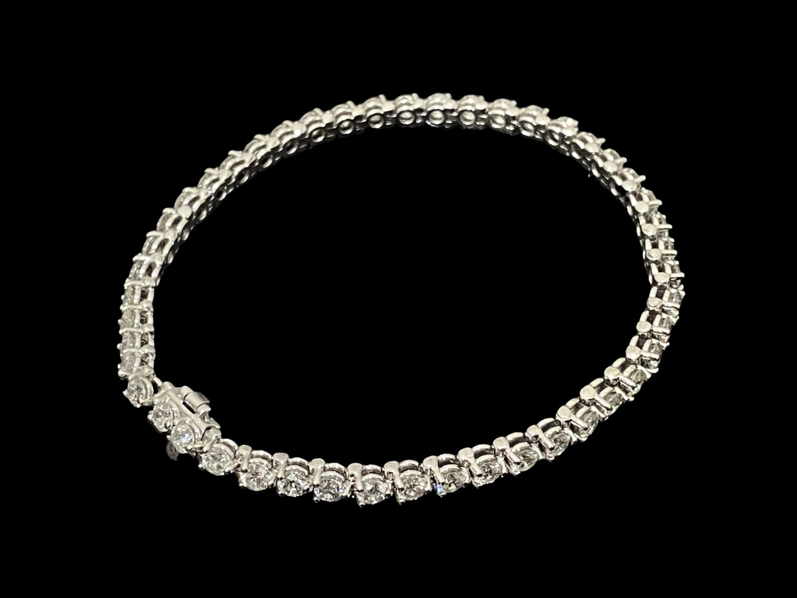 Over 5 TCW Dazzling Diamond Tennis Bracelet: 14K White Gold: Condition: Like New Brand: Unbranded Material: 14k White Gold Jewel: Diamond Diamond Type: Round Brilliant Cut Diamonds Diamond Count: 46 Total Carat Weight: Over 5 CTW Setting Type: Prong Diamond Dim