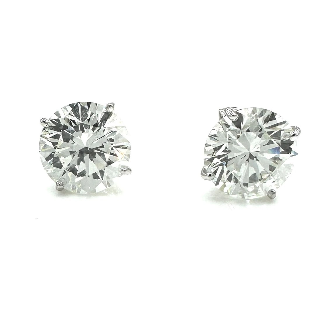 GIA CERT. 6.11 tcw. NATURAL DIAMOND PAIR OF STUD EARRINGS, ROUND BRILLIANT CUT: Natural Pair of Sudd Diamonds Set in 14K White Gold Prong Mounting for the Pierced Ears. GIA Number(s): 5221805678 / 2225839823 Total Carat Weight for the Pair: 6.11 ( 3.10 and 3.01) Stones: Natural E