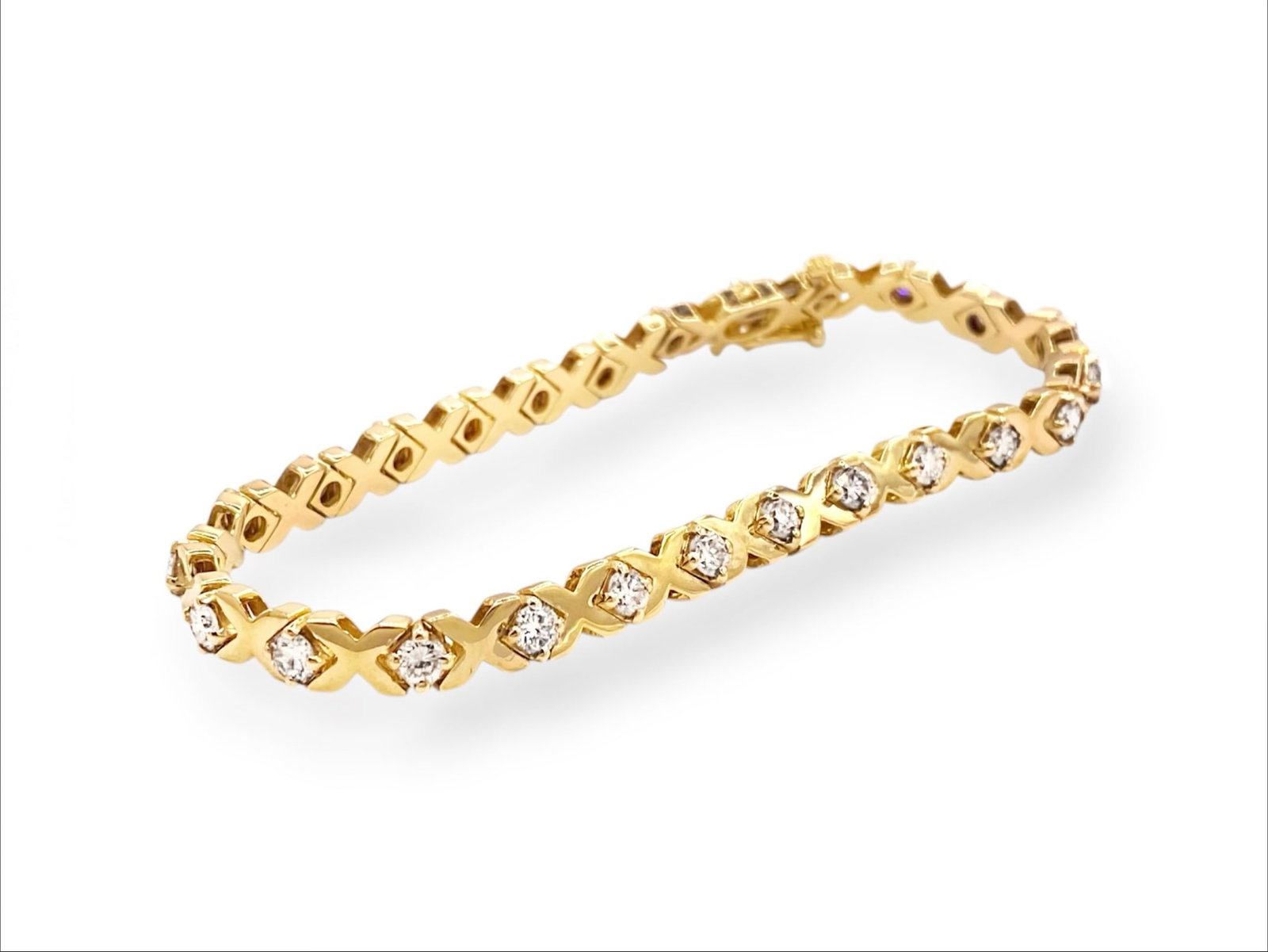 Estate 3.0 Carats Diamond "X" Tennis Bracelet in 14k Yellow Gold: Item: Bracelet. Brand: Unbranded. Style: "X" Tennis Bracelet. Metal: 14K Yellow Gold. Total weight: 11.8 grams. Bracelet Dimensions: Length: 7" inches; Width: 4.8mm. Diamonds: 25 Natural Round Brillia