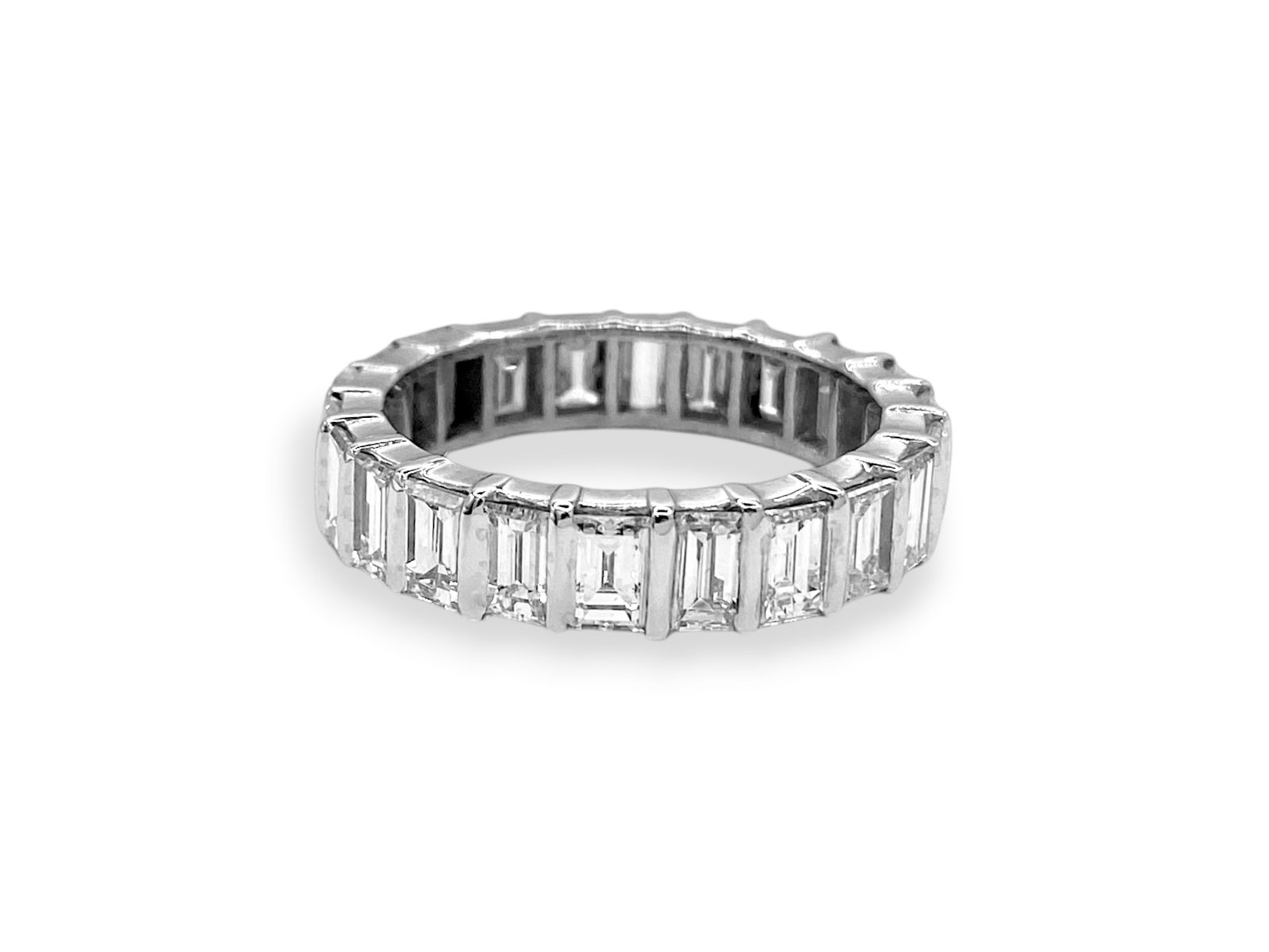 Emerald Cut Diamond Platinum Eternity Wedding Anniversary Band Ring: Item: Band Ring. Brand: Unbranded. Metal: Platinum. Total weight: 7.4 grams. Ring Size: 7.75 Diamonds: 22 Natural Emerald-cut Stones. Total carat Weight: 4.3TCW Clarity & Color: VVS; E-F. Condition: L