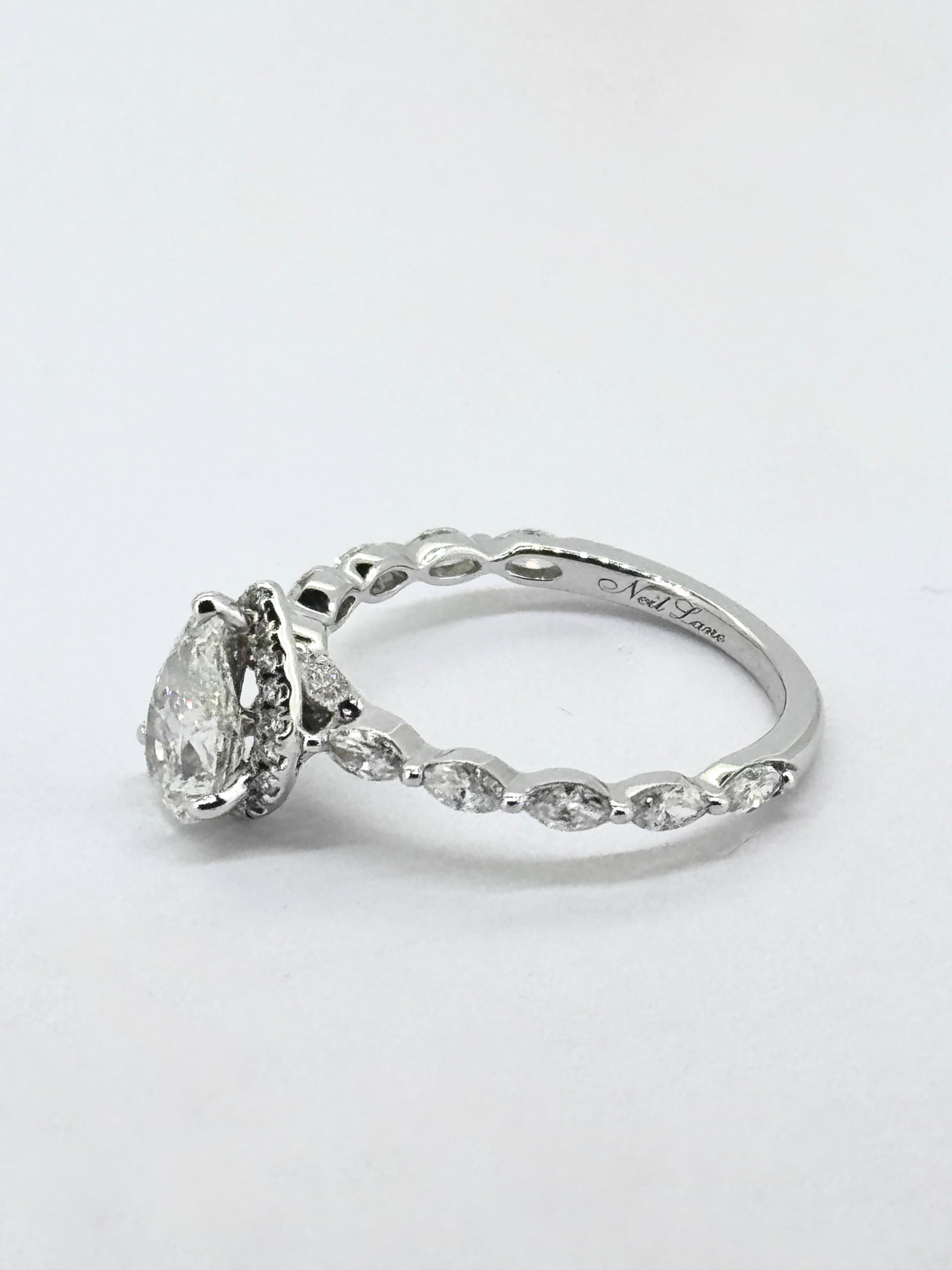 Neil Lane Premiere Pear-Shaped Diamond Engagement Ring in 14K White Gold: Condition: Like New. Brand: Neil Lane.. Metal Purity: 14k White Gold.. Gemstone: Pear-cut, Marquise-cut and Round Diamonds.. Diamond Count: 31 Round, 10 Marquise-cut and 1 Pear-cut.. Diamond Carat Wei