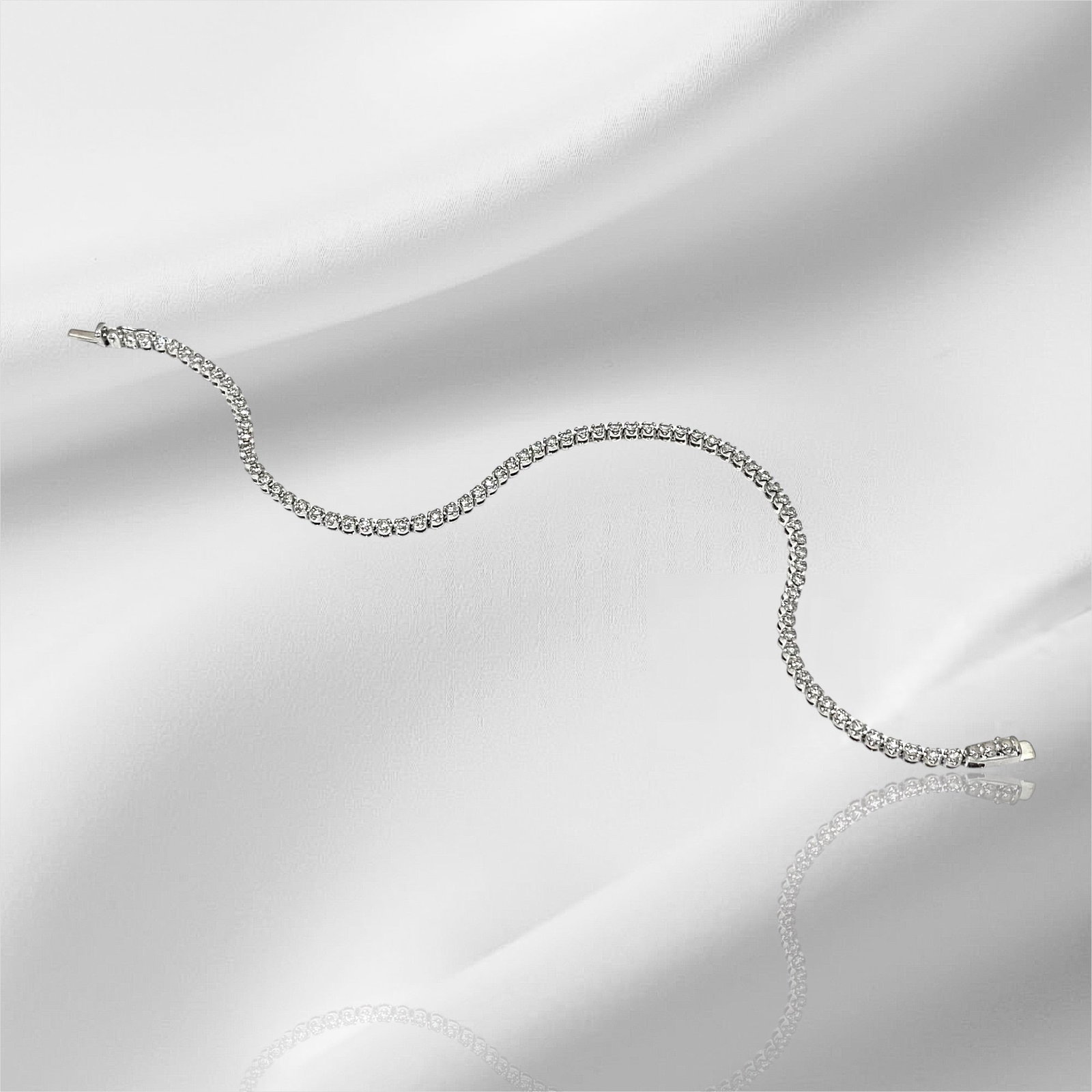 Over 2TCW Elegant Diamond Tennis Bracelet in 14k White Gold: Condition: Good. Brand: Unbranded Material: 14k White Gold. Jewel: Diamond. (3mm) Diamond Count: 74 Round Brilliant-Cut Diamond. Total carat weight: Over 2TCW Clarity and Color: VS2-SI1; I-J. Bracelet