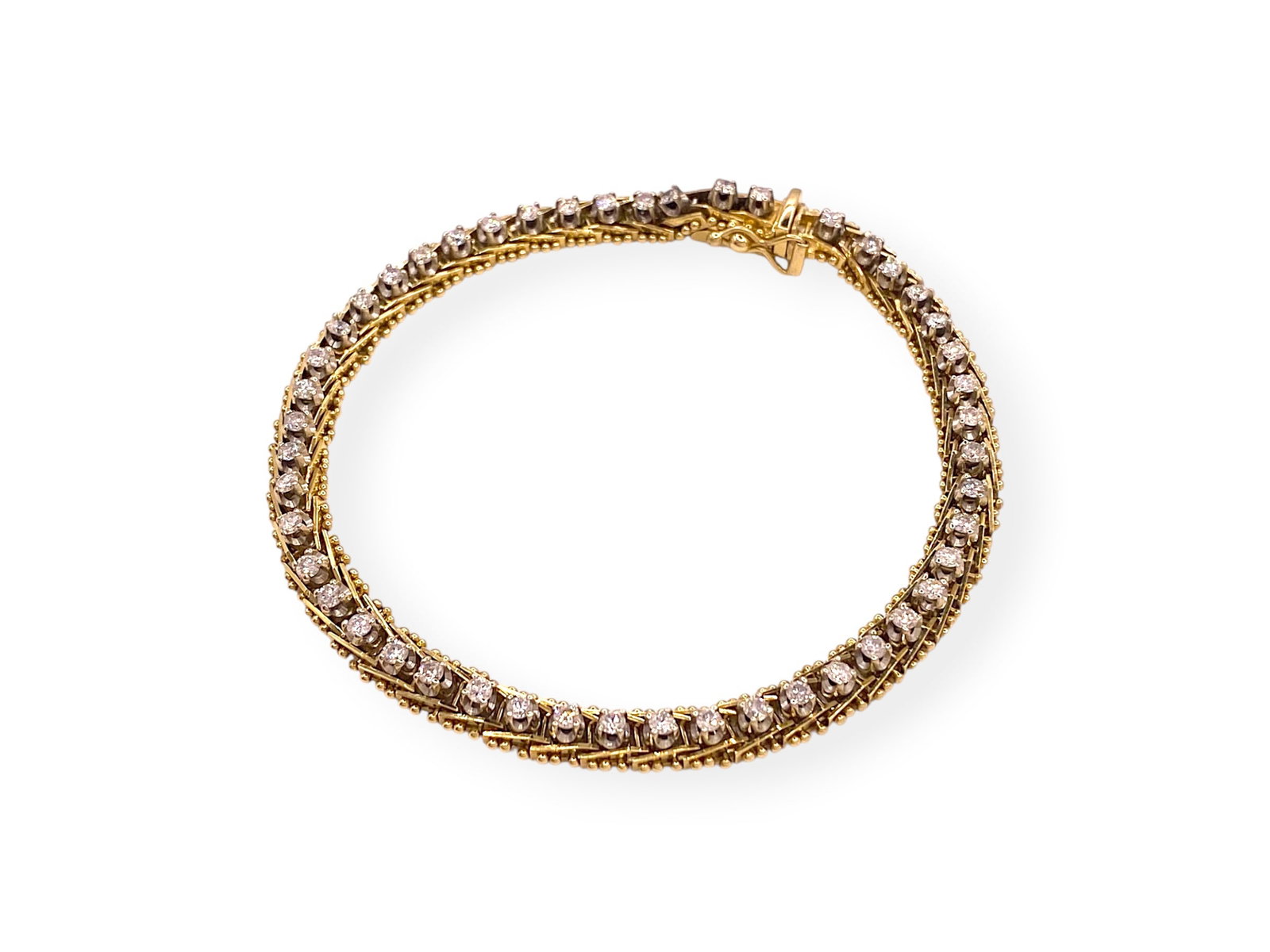 Vintage 1.50 TCW Round Brilliant Diamond Two-tone Tennis Bracelet in 14k Gold: Item: Bracelet. Brand: Unbranded. Style: "Two-tone" Tennis Bracelet. Metal: 14K Yellow-White Gold. Total weight: 14.5 grams. Bracelet Dimensions: Length: 7" inches; Width: 5.47mm. Diamonds: 48 Natural