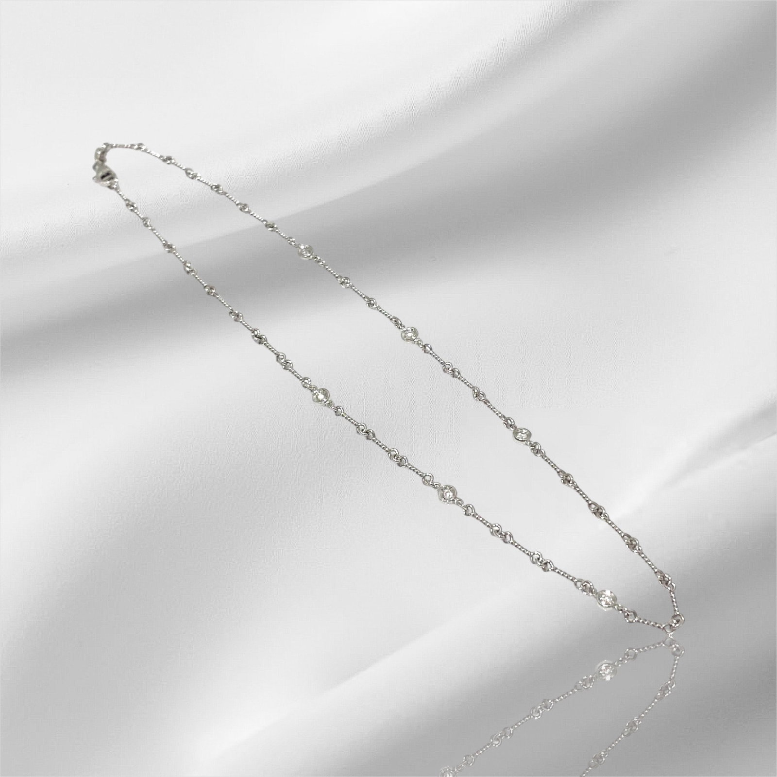 Roberto Coin 18K White Gold Bezel Set Station Diamond and Ruby Necklace, 16": Condition: Like New. Brand: Roberto Coin. Base Metal: 18k White Gold. Gemstone: Diamond. Diamond Count: 6. Necklace Dimensions: Length: 16 inch. Weight: 7.4 grams.
