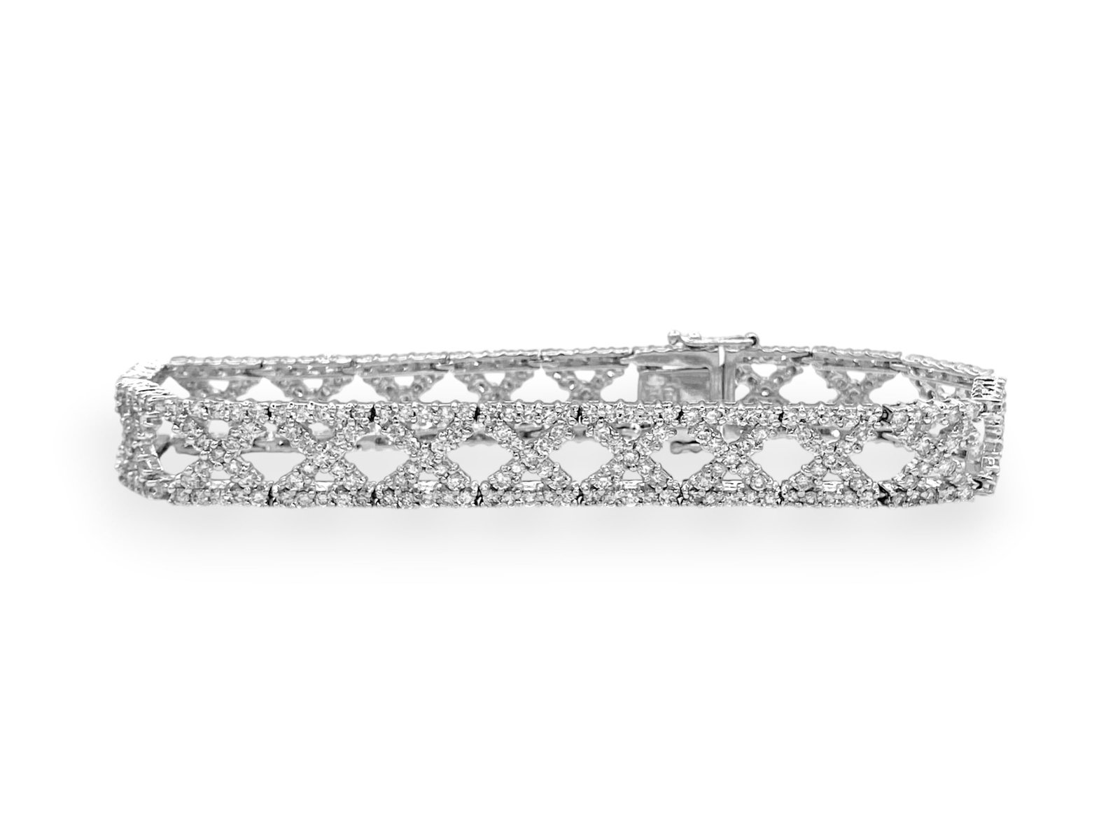 6.70 TCW Pave Diamond X Link Tennis Bracelet in 18k White Gold 7": Item: Bracelet. Brand: Unbranded. Style: "X" Tennis Bracelet. Metal: 18K White Gold. Total weight: 24 grams. Bracelet Dimensions: Length: 7" inches; Width: 9.40mm. Diamonds: 380 Natural Round Brillian