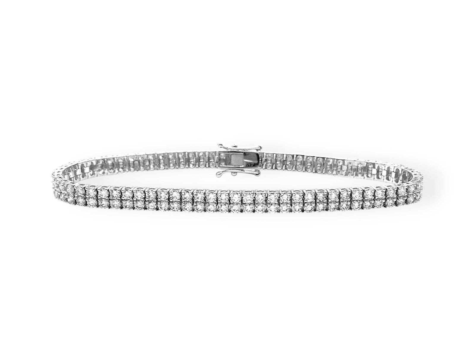 Classic 5.50 TCW Natural Diamond Two-row Tennis Bracelet in 14k White Gold: Item: Bracelet. Brand: Unbranded. Style: "Two-row" Tennis Bracelet. Metal: 14K White Gold. Total weight: 12 grams. Bracelet Dimensions: Length: 7" inches; Width: 4.58mm. Diamonds: 148 Natural Round Br