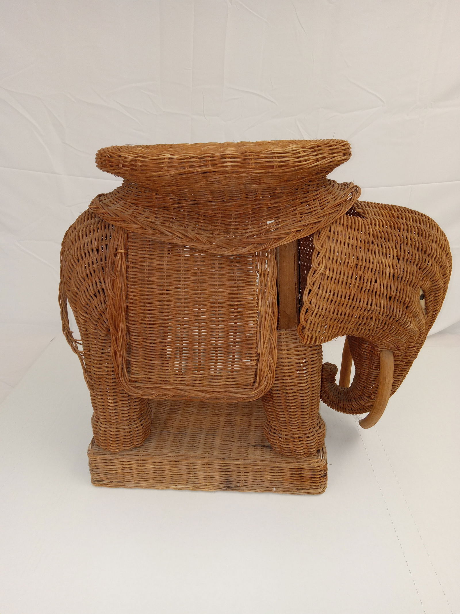 Wicker Elephant Plant Holder: Plant holder wicker elephant. Measures 24 inches tall and about 12 inches wide.