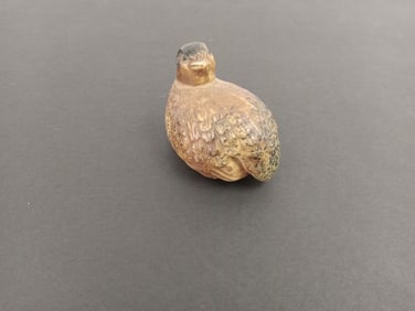Small bird figurine