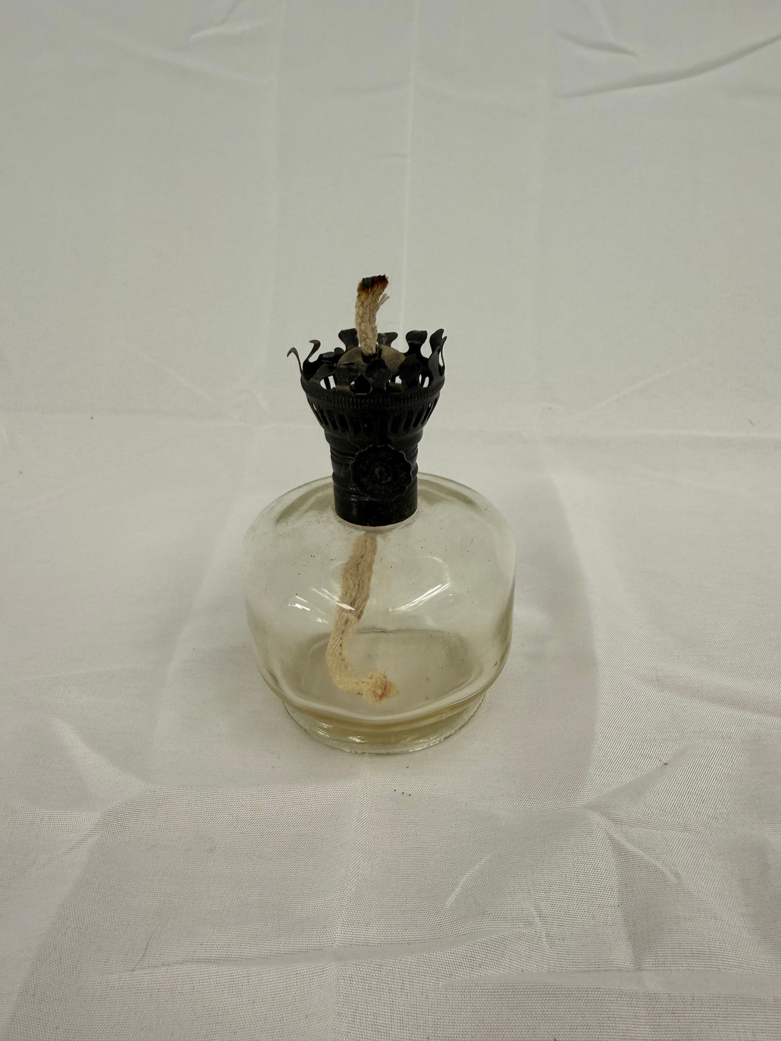 Vintage Oil Candle: Vintage oil burning candle with intact wick.