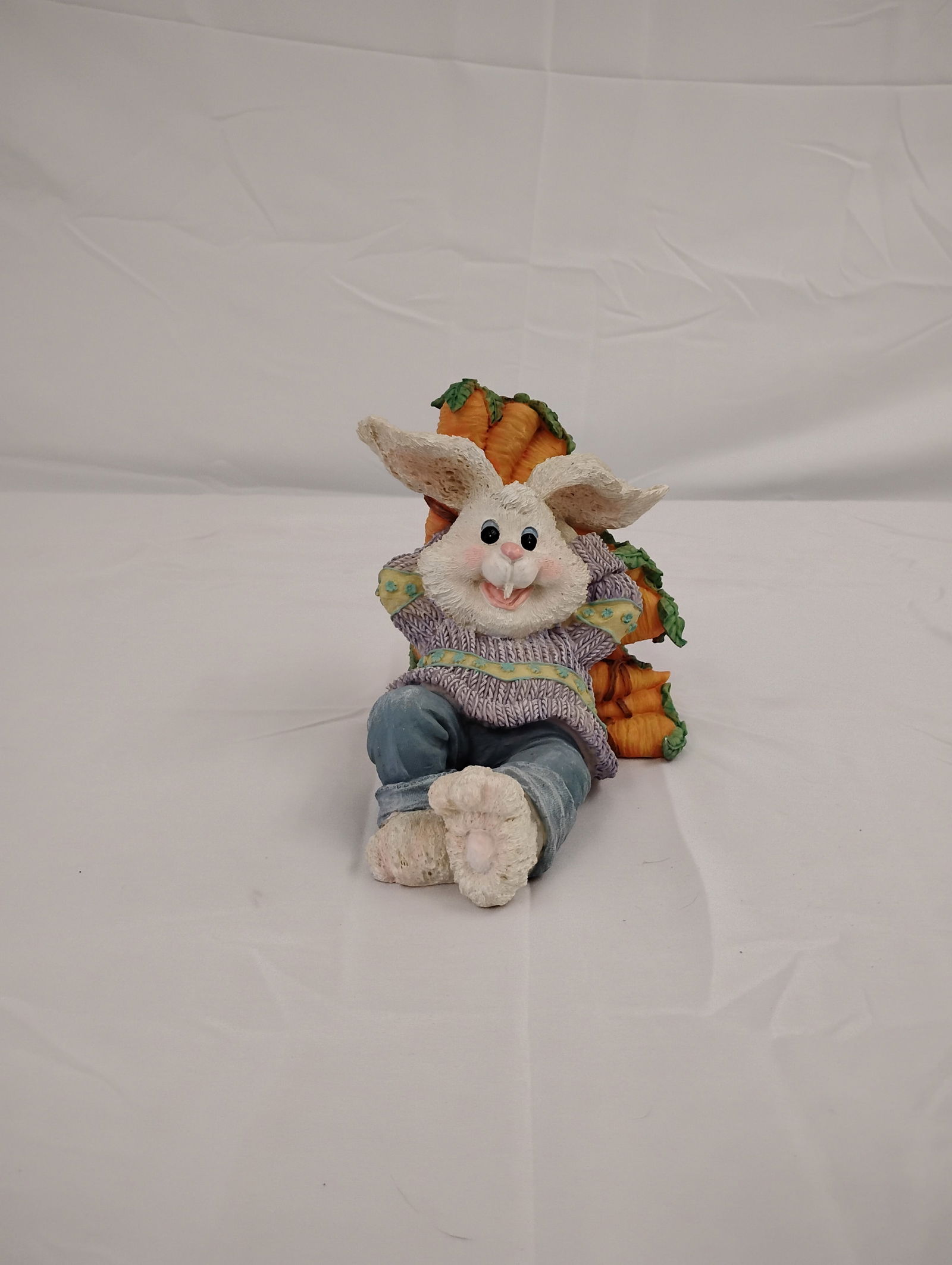 Ceramic Easter Bunny Figurine: Easter Bunny sitting on a bed of carrots figurine