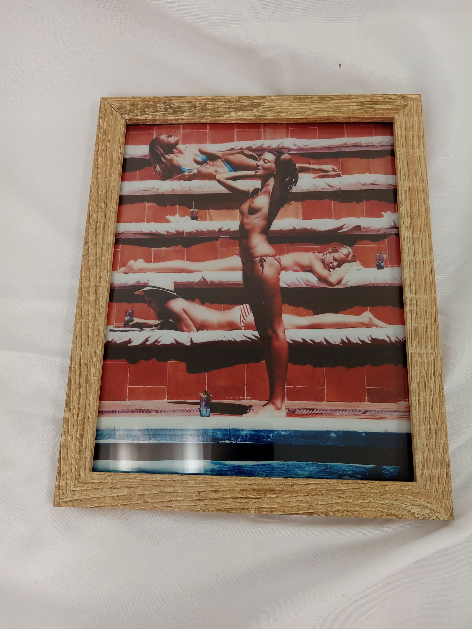 Slim Aarons "Catherine Wilke Sunbathing on Capri, 1980," Framed: Slim Aarons "Catherine Wilke Sunbathing on Capri, 1980," photo print on high gloss Kodak photo paper, Framed. Measures 8x10 inches.