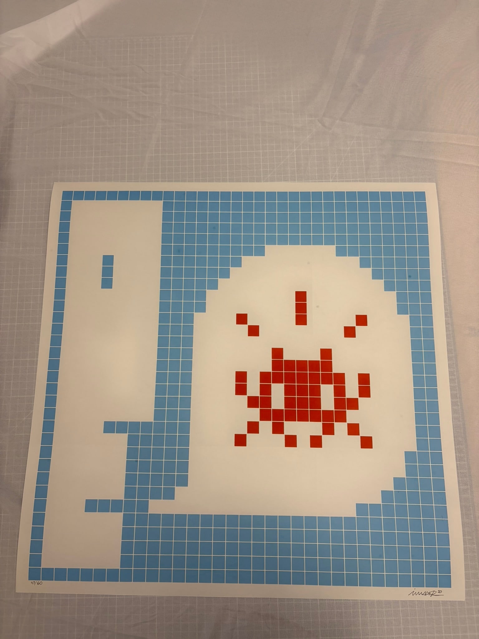 Invader "Alert Blue" 2021: Invader "Alert Blue" 2021, Printr in colors on Wove Paper, Signed, dated, and numbered from an edition of 60 in pencil. Measures 22 X 22, inches. Sold as after, these are part of the estate sale