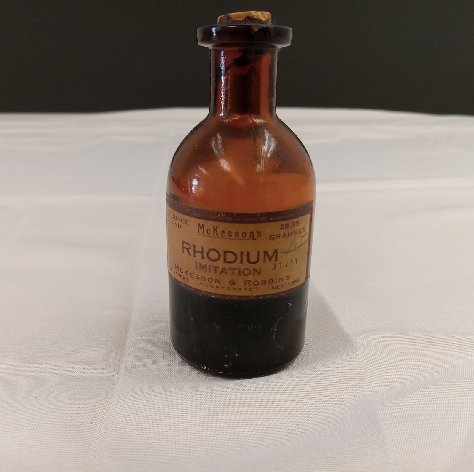 Antique Glass McKesson's Rhodium Imitation Bottle: Antique Glass bottle. About 4 inches tall. These are part of the estate sale and we do not have a COA. All lots offered in our auctions are sold strictly on an "AS IS" basis. Any descriptions regardin