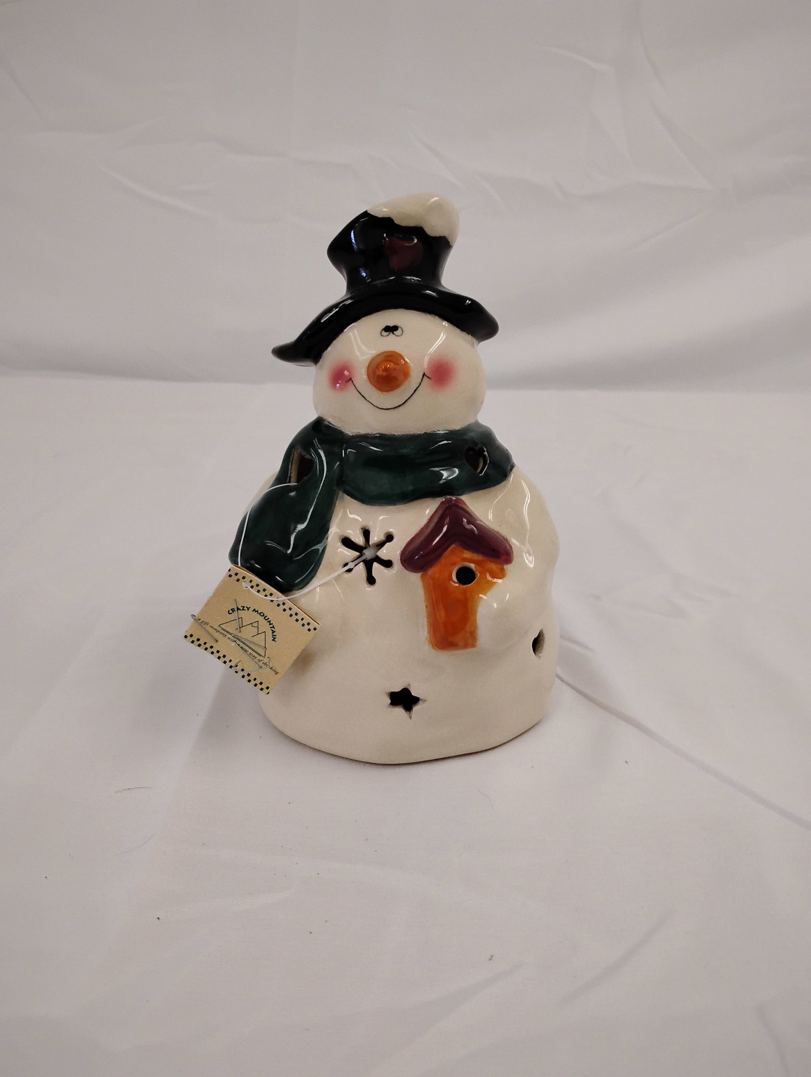 Decorative Snow Man Candle Holder: Candle holder snowman with snowflake cutouts for providing shadows. These are part of the estate sale and we do not have a COA. All lots offered in our auctions are sold strictly on an "AS IS" basis. 