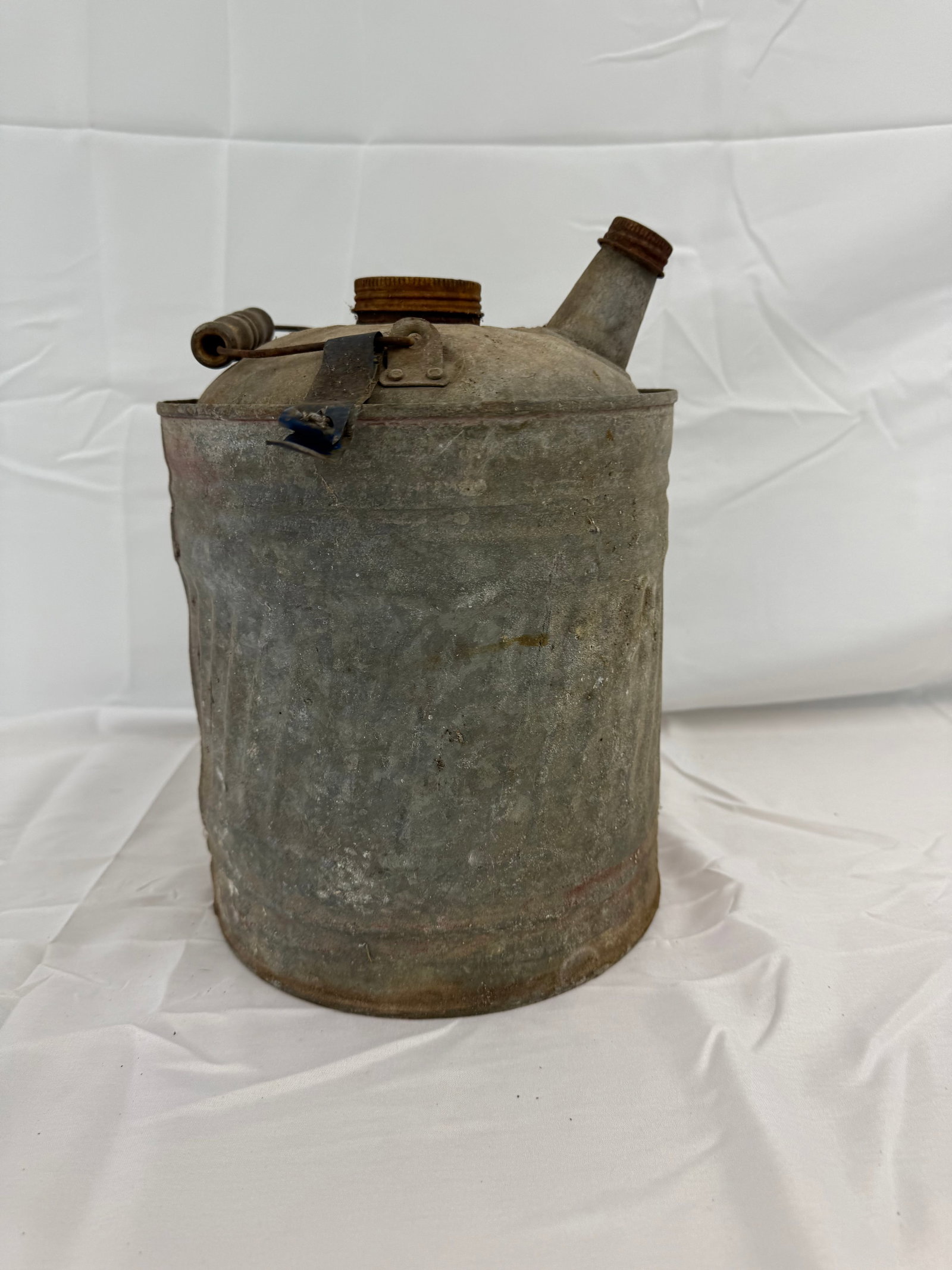 Antique Tin Gas Gallon Can: Tin Gas Can antique with caps and handles. These are part of the estate sale and we do not have a COA. All lots offered in our auctions are sold strictly on an "AS IS" basis. Any descriptions regardin