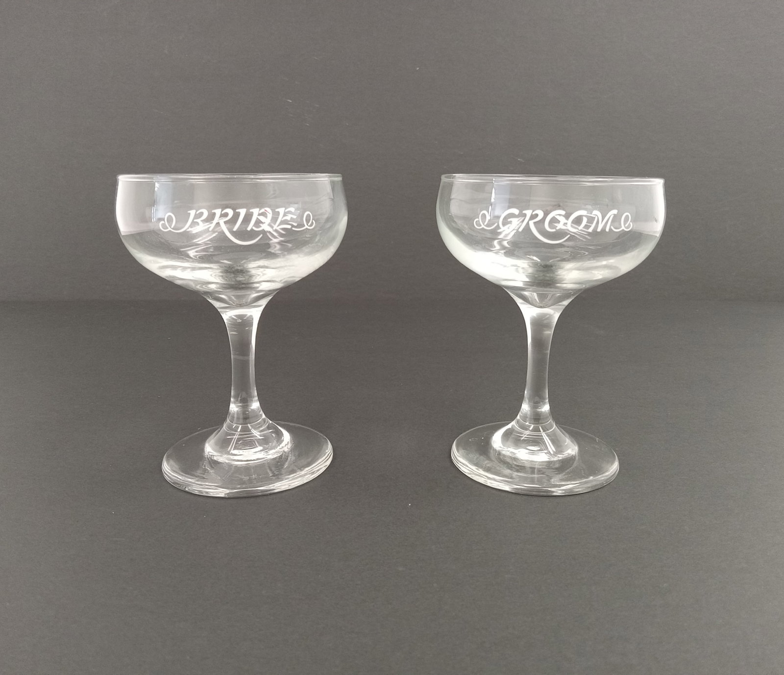 Bride and Groom Glassware set of 2: 2 Wine Glasses Bride and Groom Antique glassware handpainted These are part of the estate sale and we do not have a COA. All lots offered in our auctions are sold strictly on an "AS IS" basis. Any