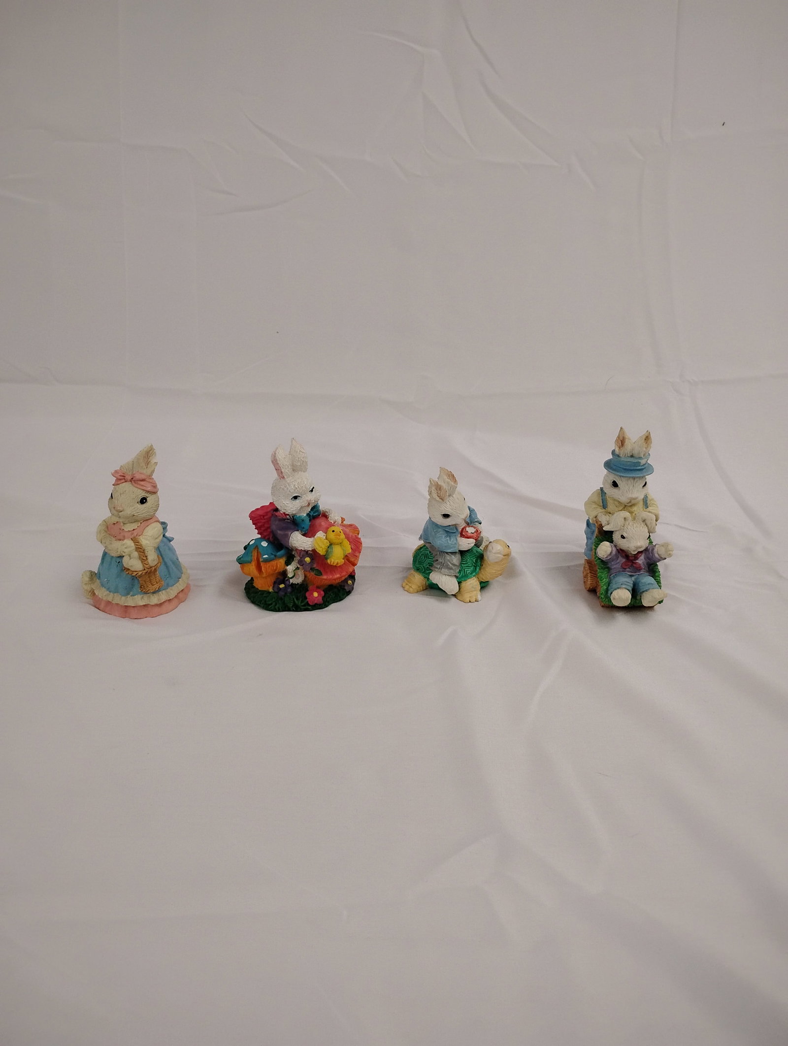 4 Easter Bunny Figurines: Antique Easter Bunny figurines Set of 4 These are part of the estate sale and we do not have a COA. All lots offered in our auctions are sold strictly on an "AS IS" basis. Any descriptions regarding a