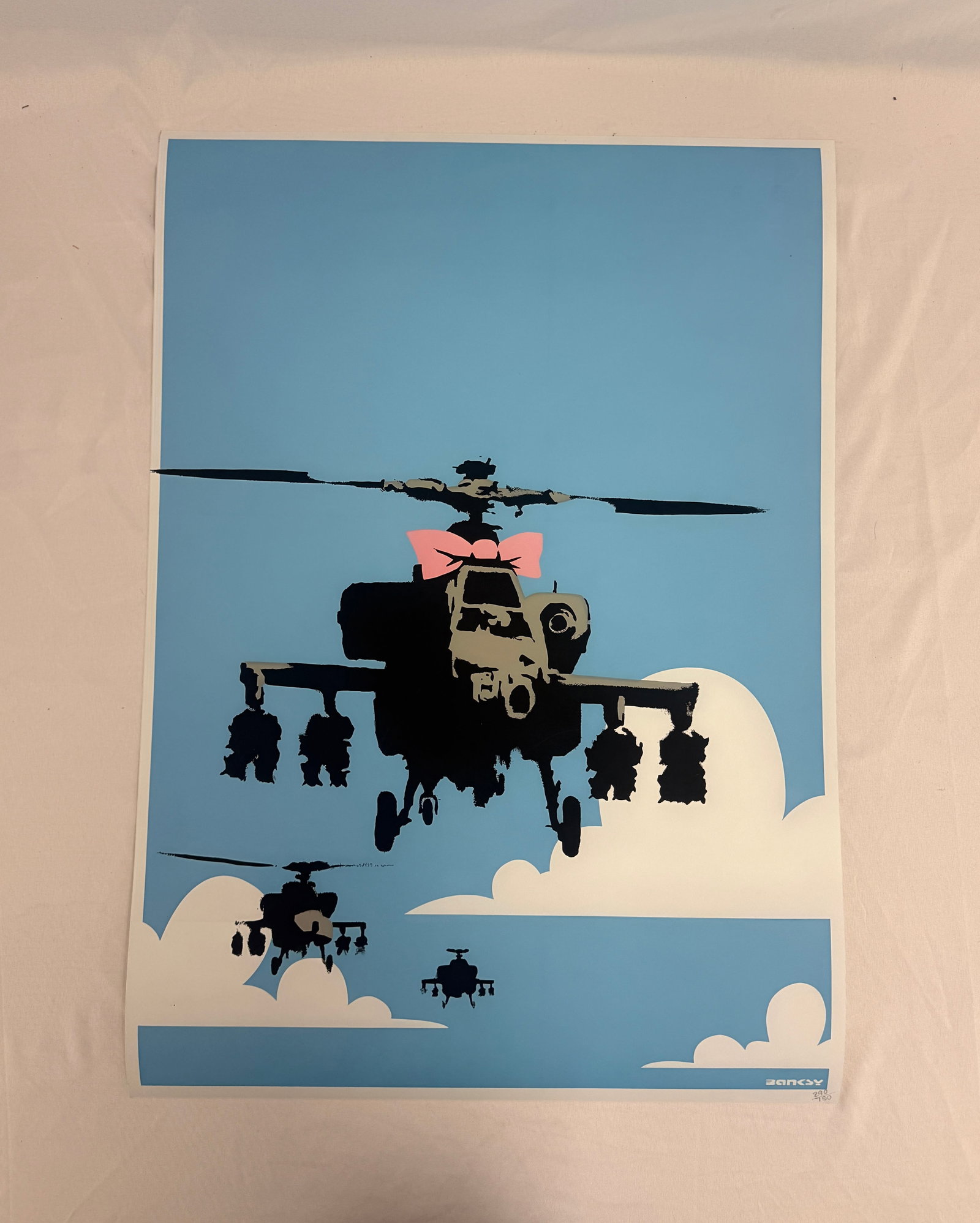 Banksy "Happy Chopper" Print after: Banksy "Happy Chopper" signed Print on wove paper, Measures 27 3/8 x 19 1/2 inches. Sold after. These are part of the estate sale and we do not have a COA. All lots offered in our auctions are sold st