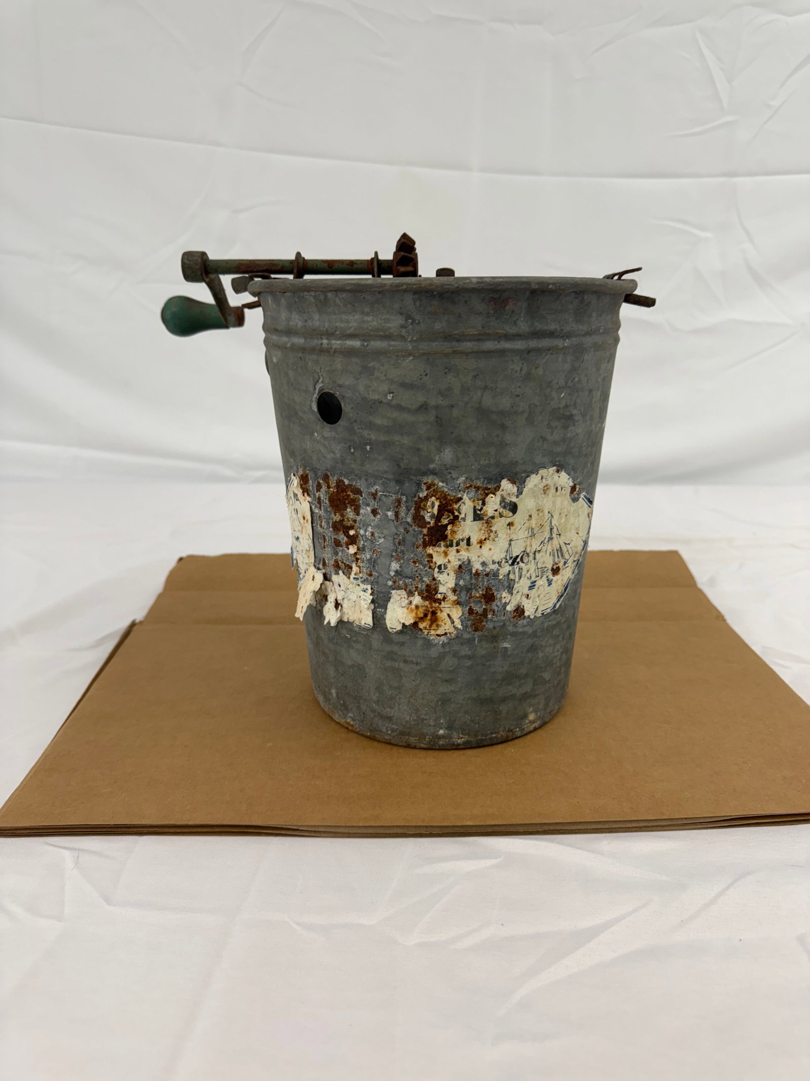 Vintage Galvanized Hand Cranked Ice Cream Maker: Vintage Galvanized Hand Cranked Ice Cream maker These are part of the estate sale and we do not have a COA. All lots offered in our auctions are sold strictly on an "AS IS" basis. Any descriptions