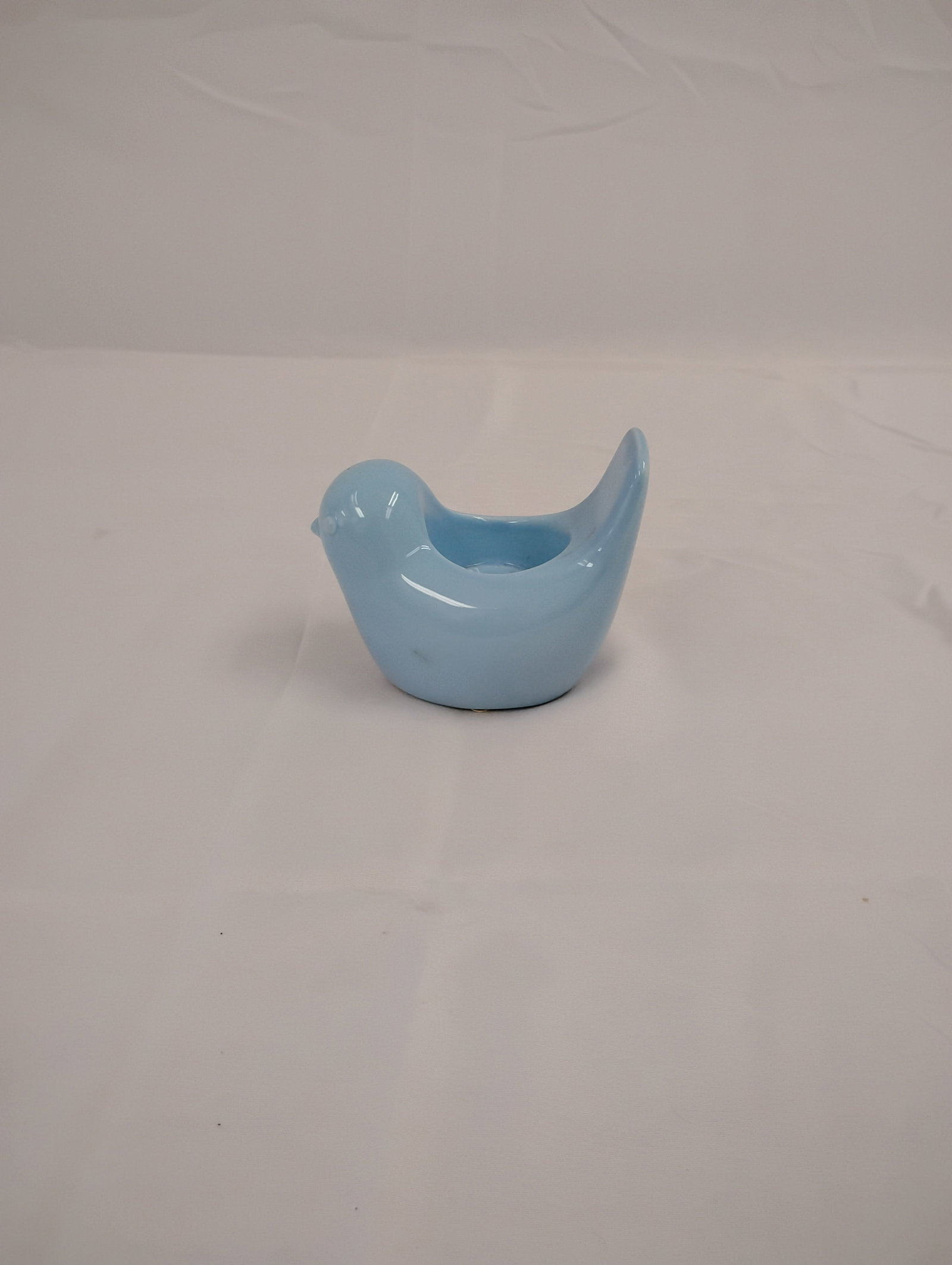 Small Blue Ceramic Bird Tealight Candle Holder: Blue ceramic bird figurine with tealight candle holder. Measures 4x3 inches. These are part of the estate sale and we do not have a COA. All lots offered in our auctions are sold strictly on an "AS