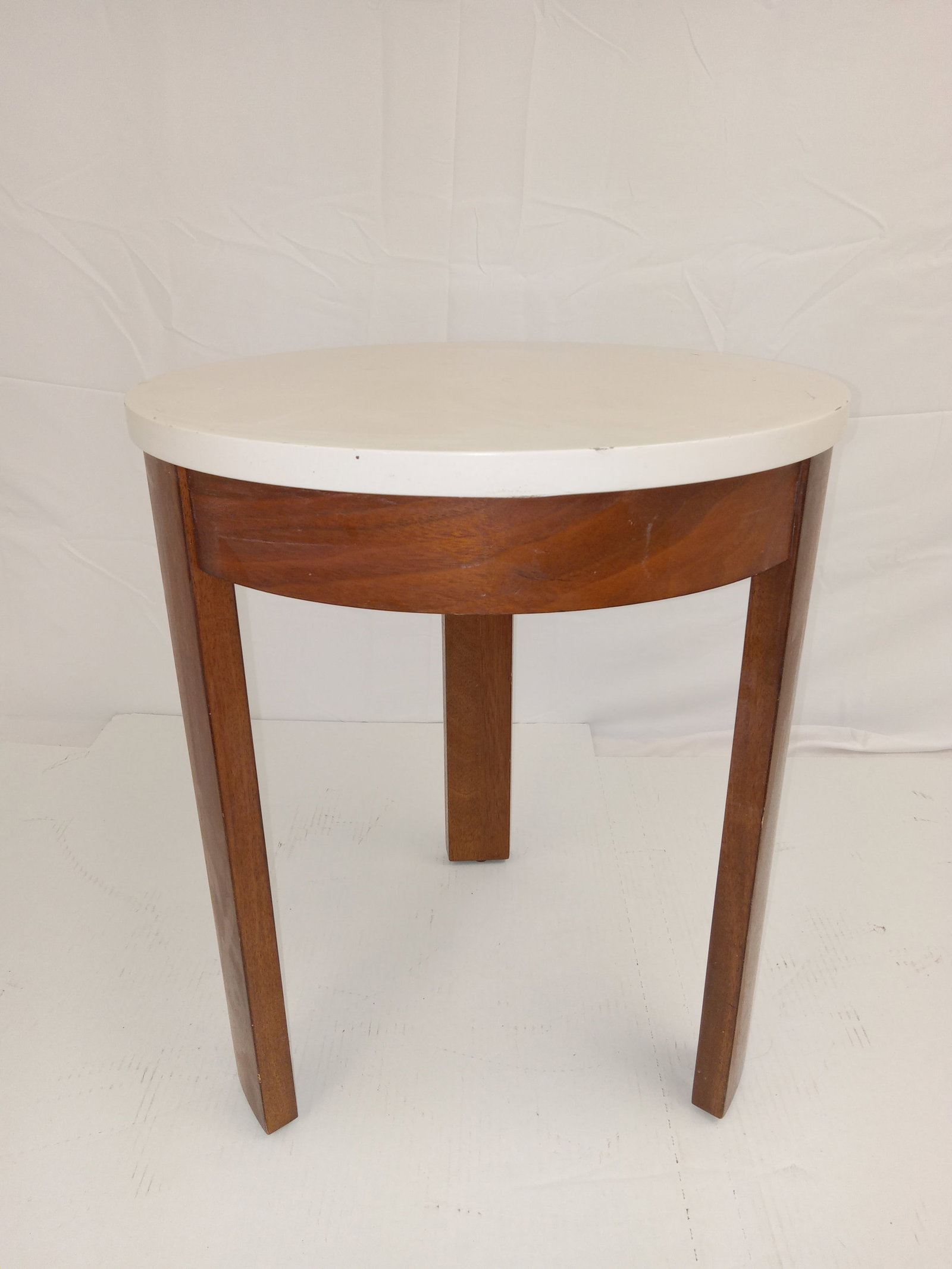 Crate and Barrel Decorative End Table: 3 Legged Crate and Barrel End Table. About 24 in tall x 12 in diameter table top. These are part of the estate sale and we do not have a COA. All lots offered in our auctions are sold strictly on an "