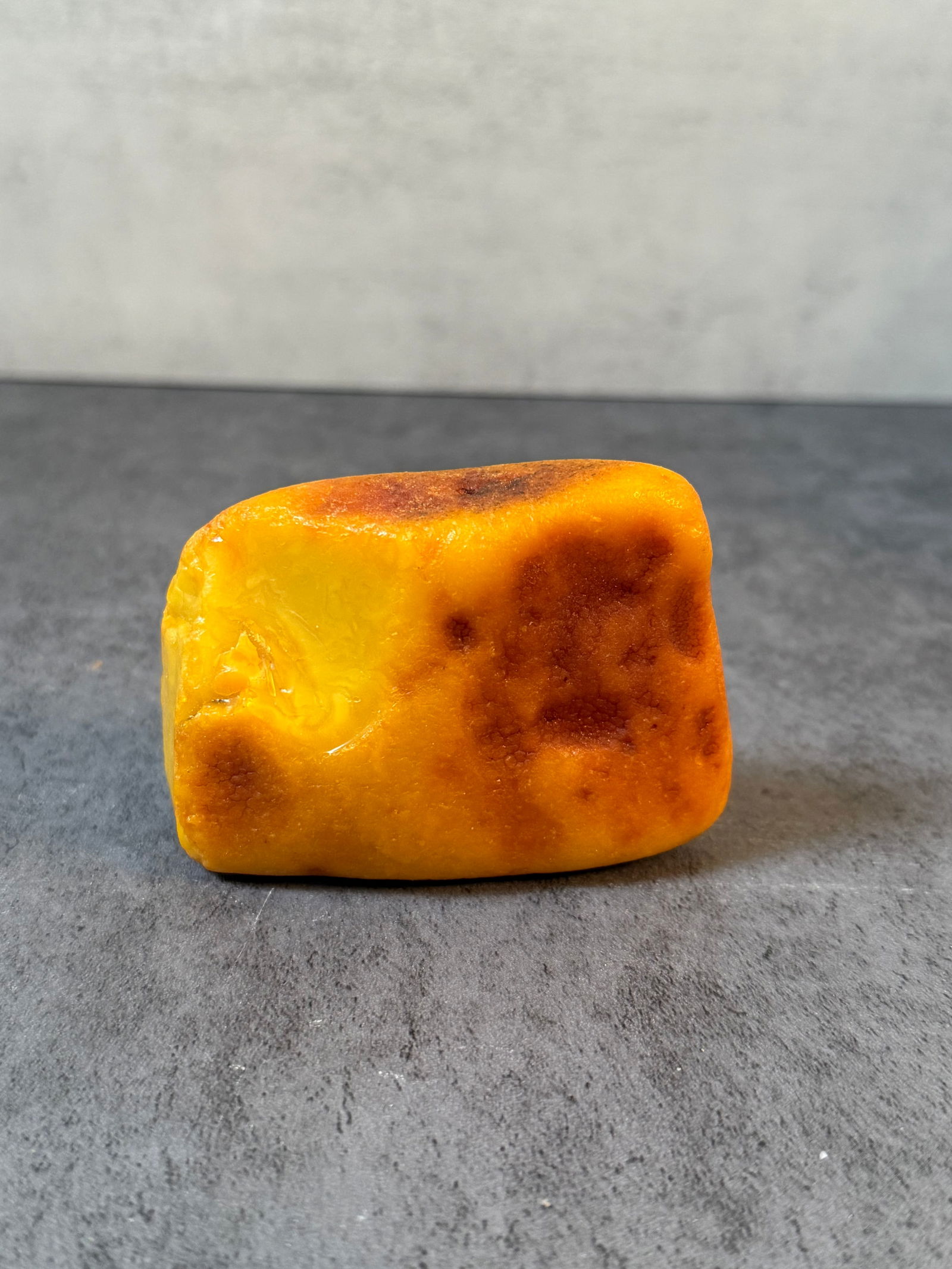 Big piece of amber, Approx. 4 oz: The materials appear to be early amber or similar synthetic material, showing age-related surface wear, oxidation, and natural imperfections from storage and handling. Exact material composition has