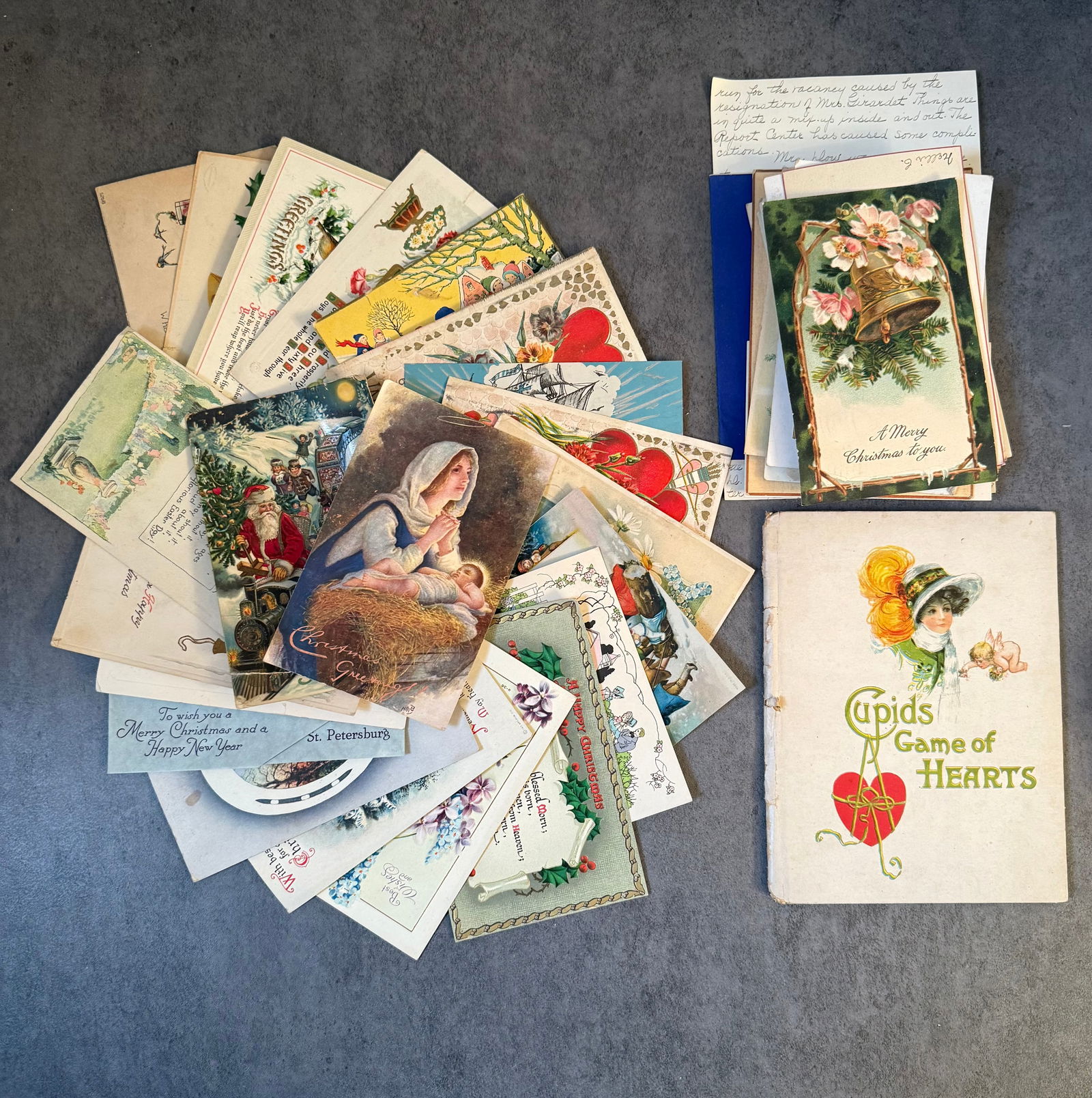 Large Group of Vintage Holiday Postcards & Greeting Cards, Early 20th Century: A large assorted group of vintage holiday postcards and greeting cards, primarily dating from the early to mid-20th century, featuring a variety of festive and sentimental themes.The group includes