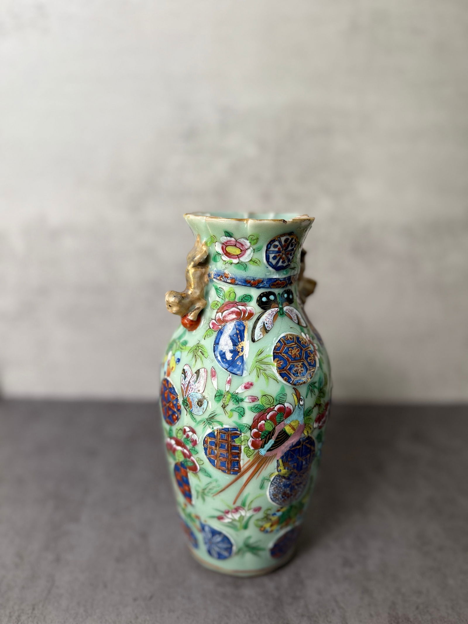 Chinese Famille Rose Porcelain Vase ?19th Century: A Chinese porcelain vase, late Qing Dynasty (19th century), painted in famille rose enamels with figural and floral decoration, enhanced with gilt accents. The neck is applied with molded decorative e