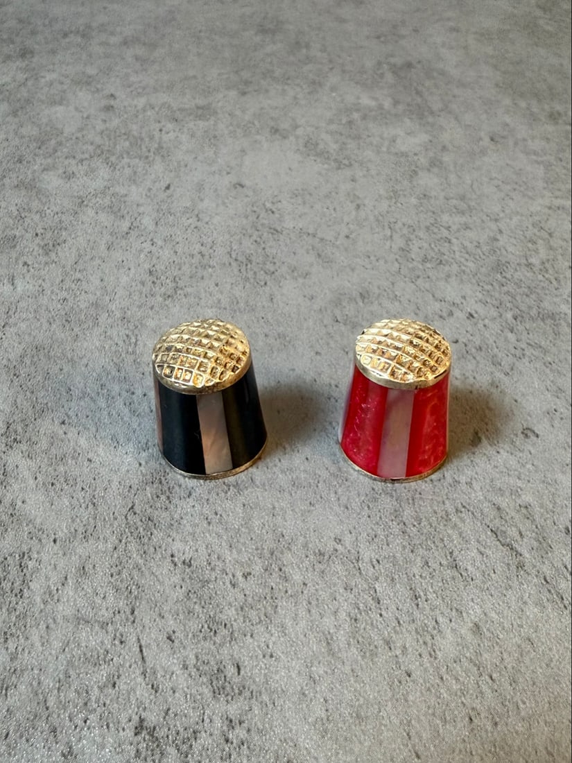 Pair of Vintage Mexico Sterling Silver Enamel Thimbles - Red and Black Striped Design: A charming pair of vintage decorative thimbles featuring bold enamel work in a striking striped pattern. Each thimble showcases horizontal bands of vibrant color - one with red and white stripes, the