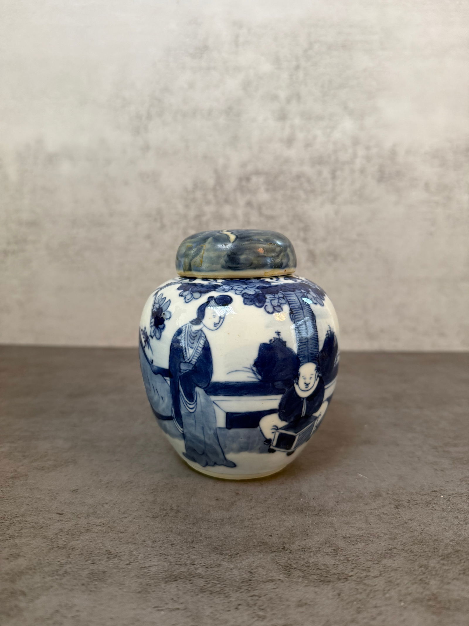Chinese Blue and White Porcelain Ginger Jar and Cover with Figural Decoration, 20th Century: A Chinese blue and white porcelain ginger jar and cover of ovoid form, decorated with court figures in a garden setting with floral motifs. Double circle mark to base. Height 5 inches.