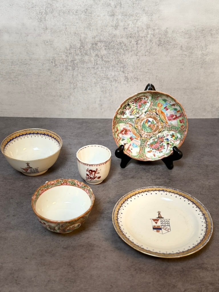 Chinese Export Porcelain Rose Medallion and Armorial Decorative Lot: A group of Chinese export porcelain items including a Rose Medallion decorated teacup and saucer, along with additional armorial and figural decorated bowls and cups. Featuring hand-painted polychrome