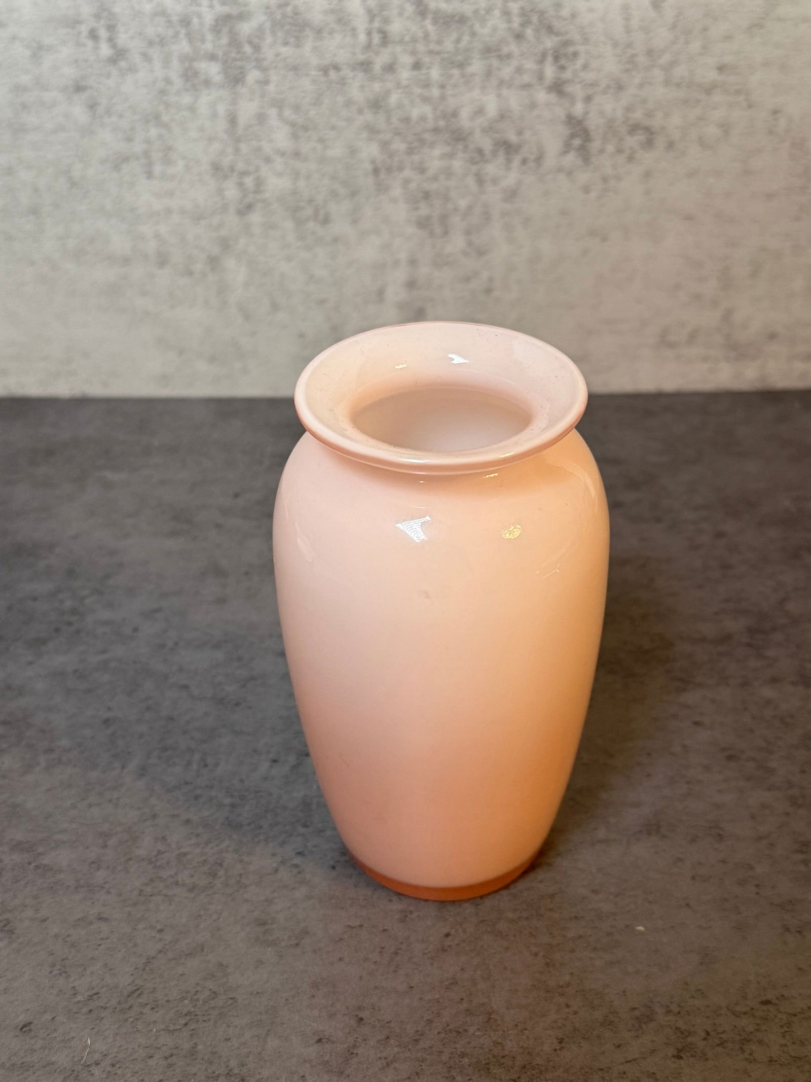 Japanese Pink Cased Art Glass Vase: A Japanese pink cased art glass vase of ovoid form with a flared rim. Suitable for decorative display.